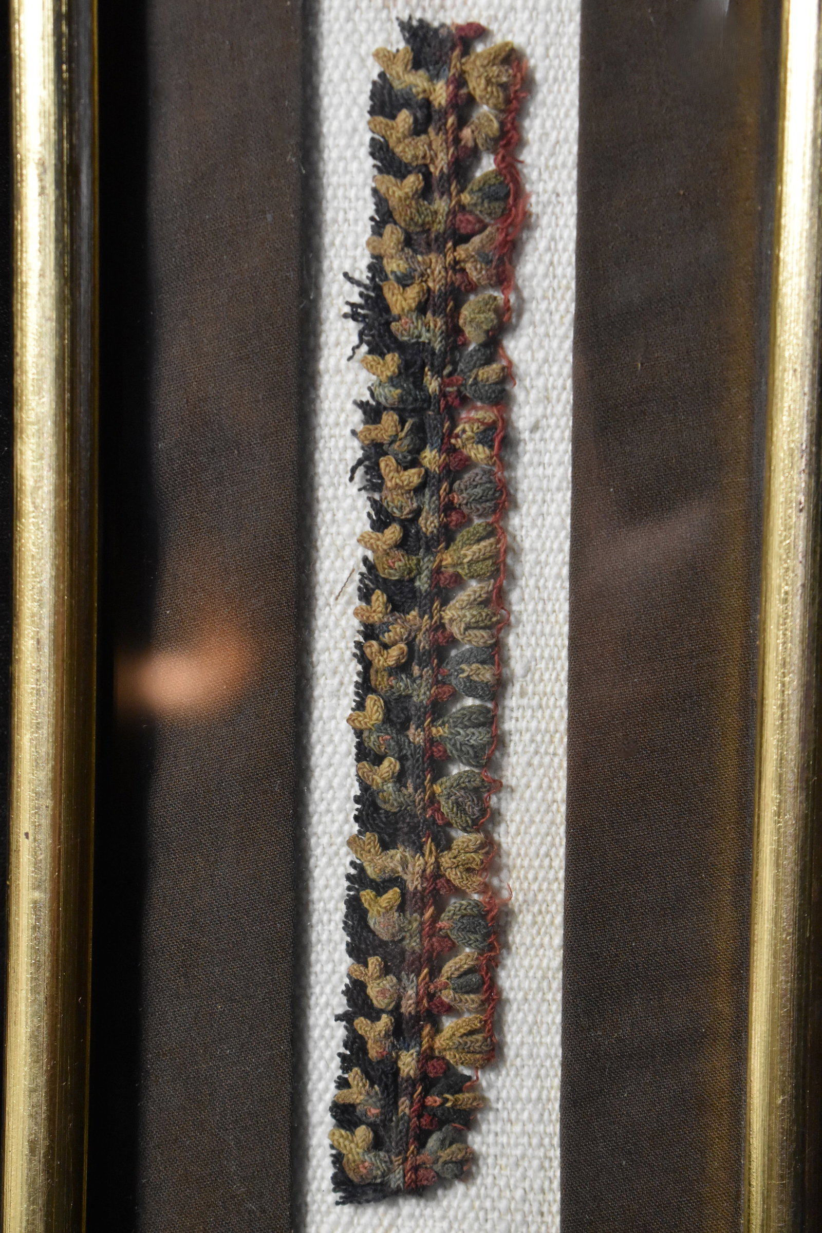Nasca Ornamental Tassel Made by the Nasca 200 BCE to 600 CE: Nasca Ornamental Tassel by the Nasca 200 BCE to 600 CE. Colorful example of the traditional textiles made by the Nasca people. Made of camelid fibre and cotton. Nicely framed long ago. The tassels att