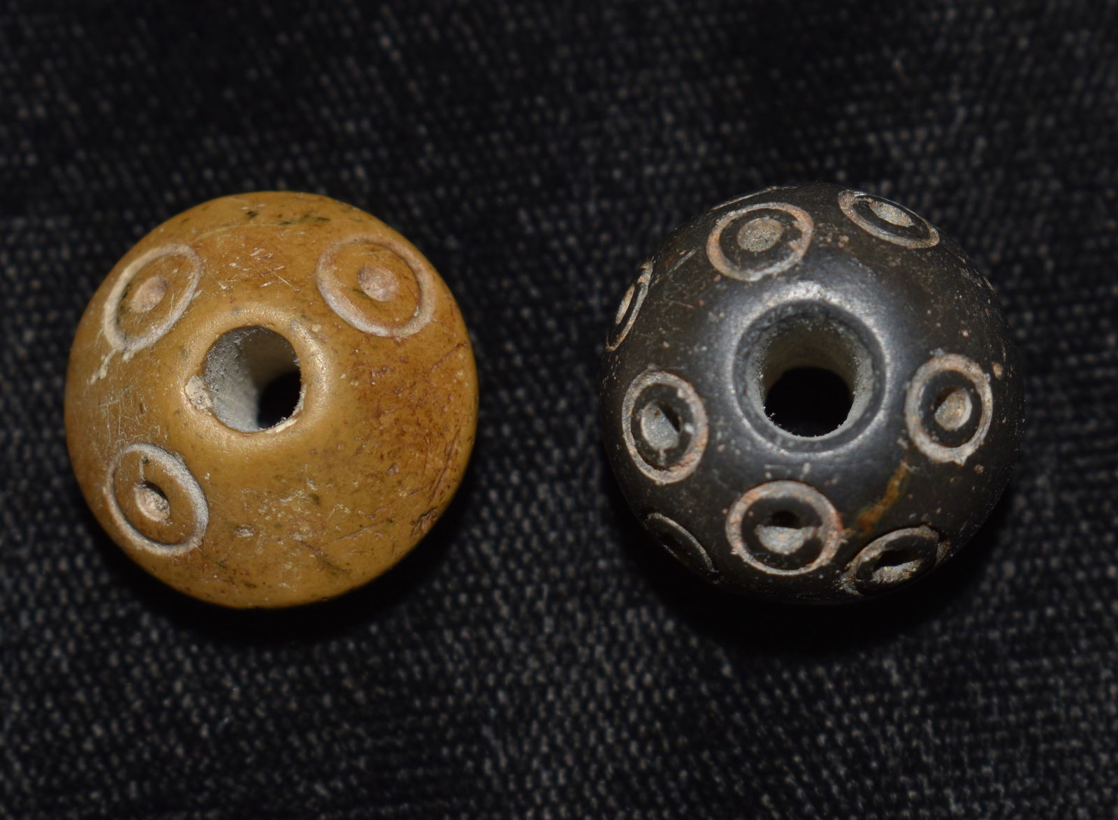 2 Highly Engraved Pre-Columbian Spindle Whorl Beads: 2 Highly Engraved Pre-Columbian Spindle Whorl Beads. Both are outstanding examples. They both measure approximately 3/4" Diameter. From the Chuck and Eileen Hoffman Collection. Chuck and his wife spen