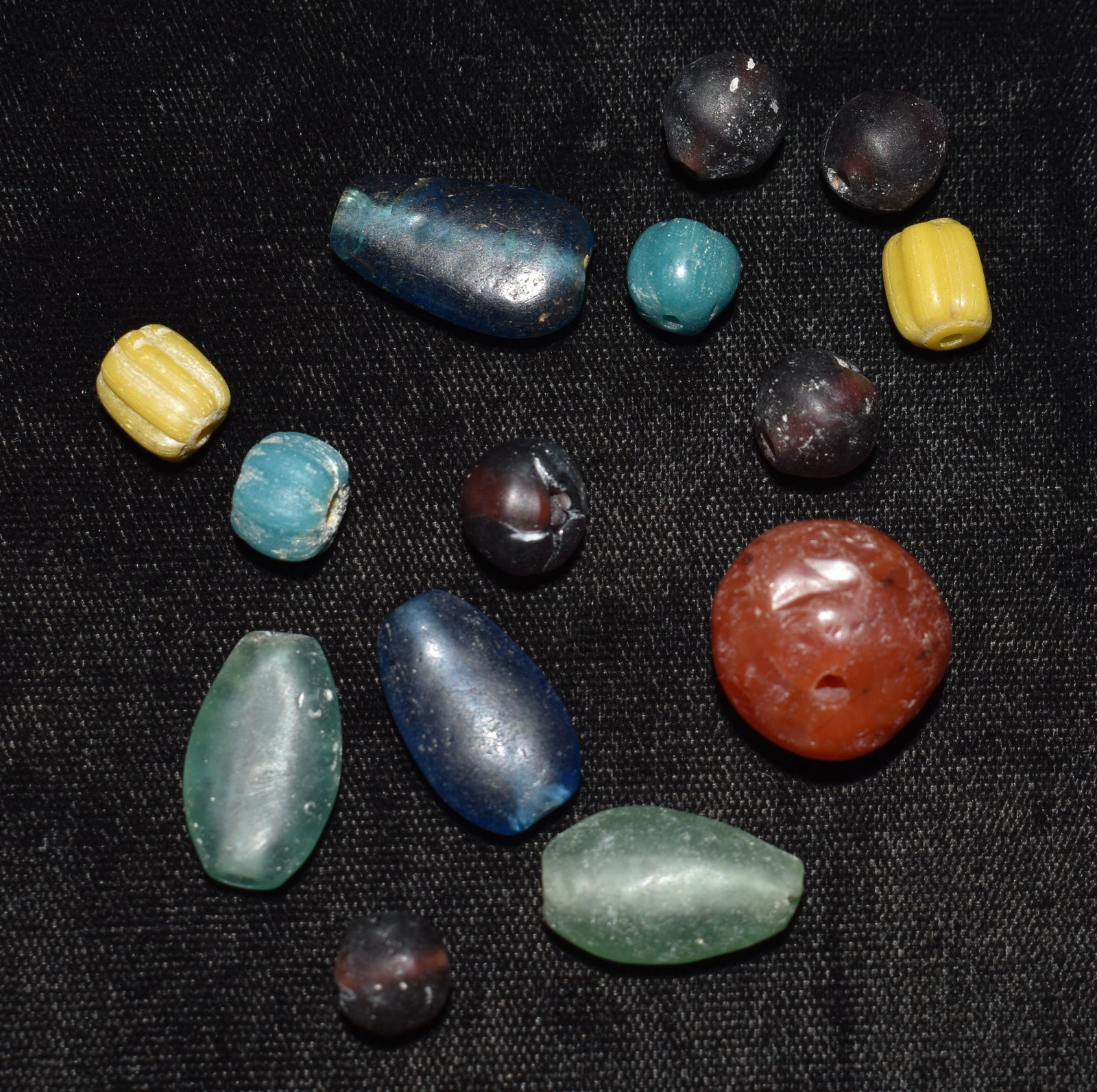 13 Ancient Pyu Colorful Glass Beads: 13 Ancient Pyu Colorful Glass Beads. The larger orange one may be an agate. Ancient Pyu glass beads from Myanmar (Burma), which are known for their vibrant colors and intricate designs. These beads da