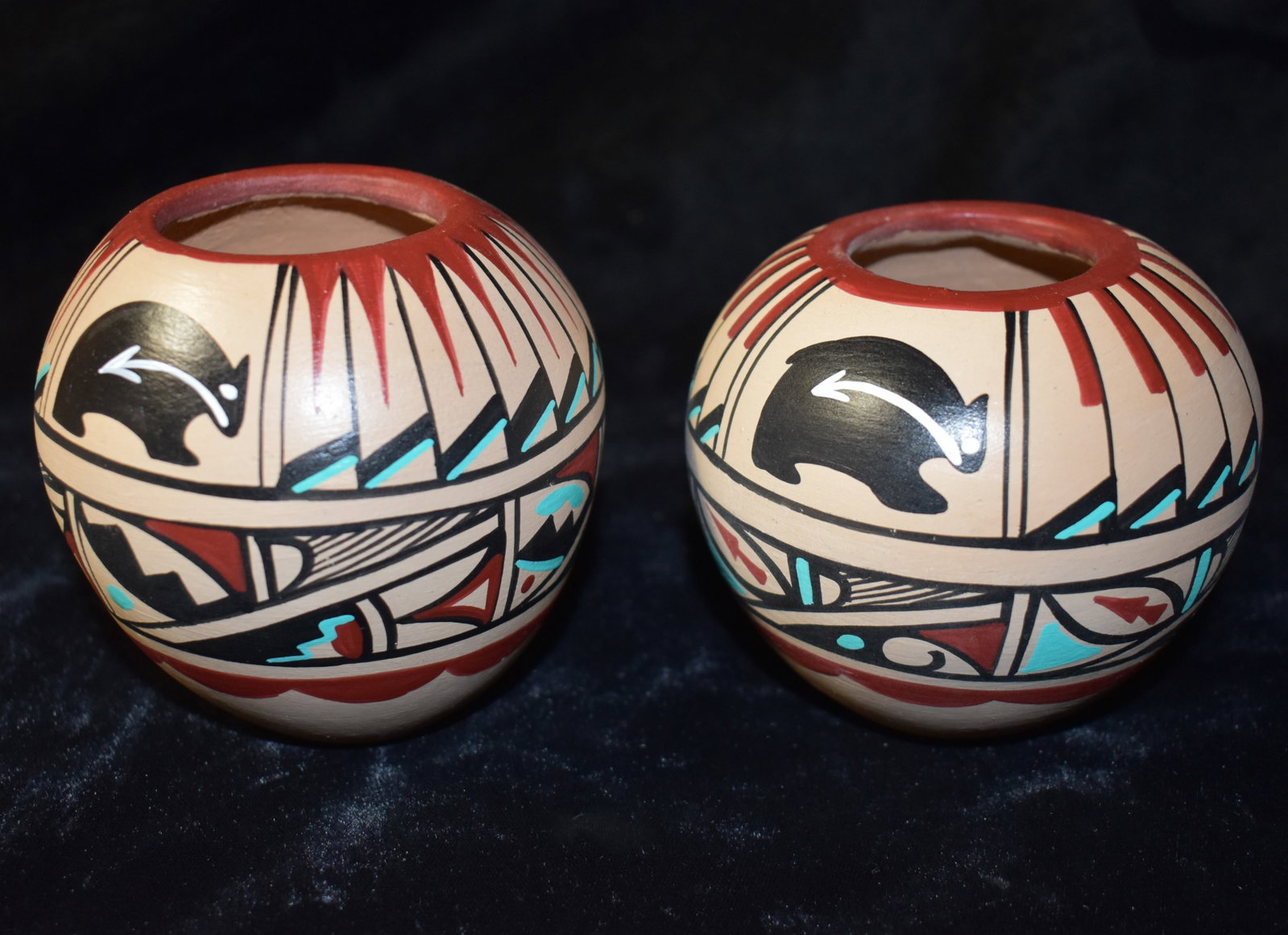 2 Matching Haind Painted Pueblo Pots by MTC Jemez - Ex Pride of the Nations: 2 Matching Haind Painted Pueblo Pots by MTC Jemez - Ex Pride of the Nations Store. Both are in excellent/New condition. They measure 3" and 3 1/4" tall approximately. Painting patterns by MTC Jemez ar