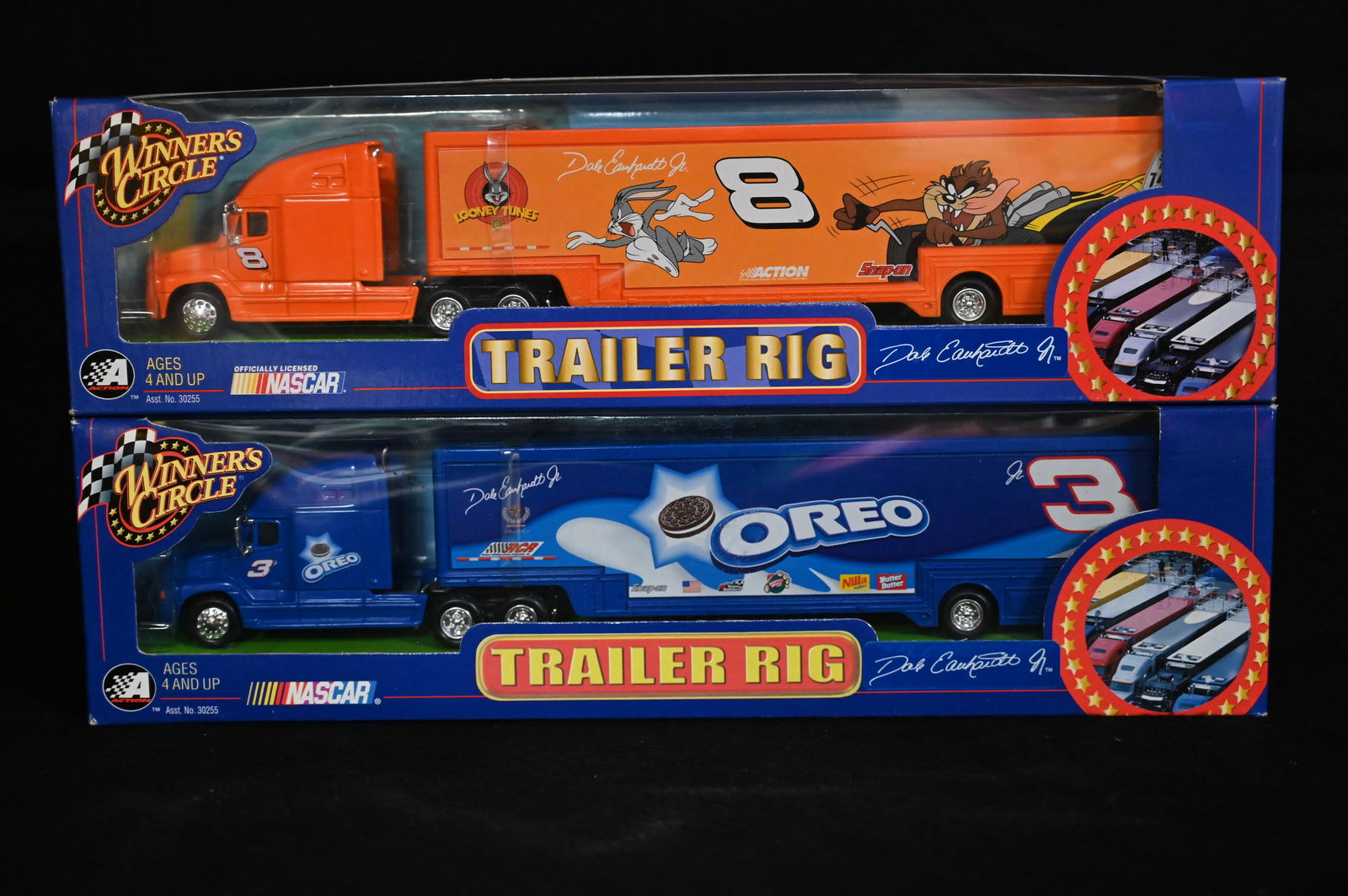2 NASCAR 2002 Trailer Rig's Dale Earnhardt Jr. "Looney Tunes" & "Oreo" 1/64 Scale Produced by: 2 NASCAR 2002 Trailer Rig's Dale Earnhardt Jr. "Looney Tunes" & "Oreo" 1/64 Scale Produced by Winner's Circle in brand new condition.