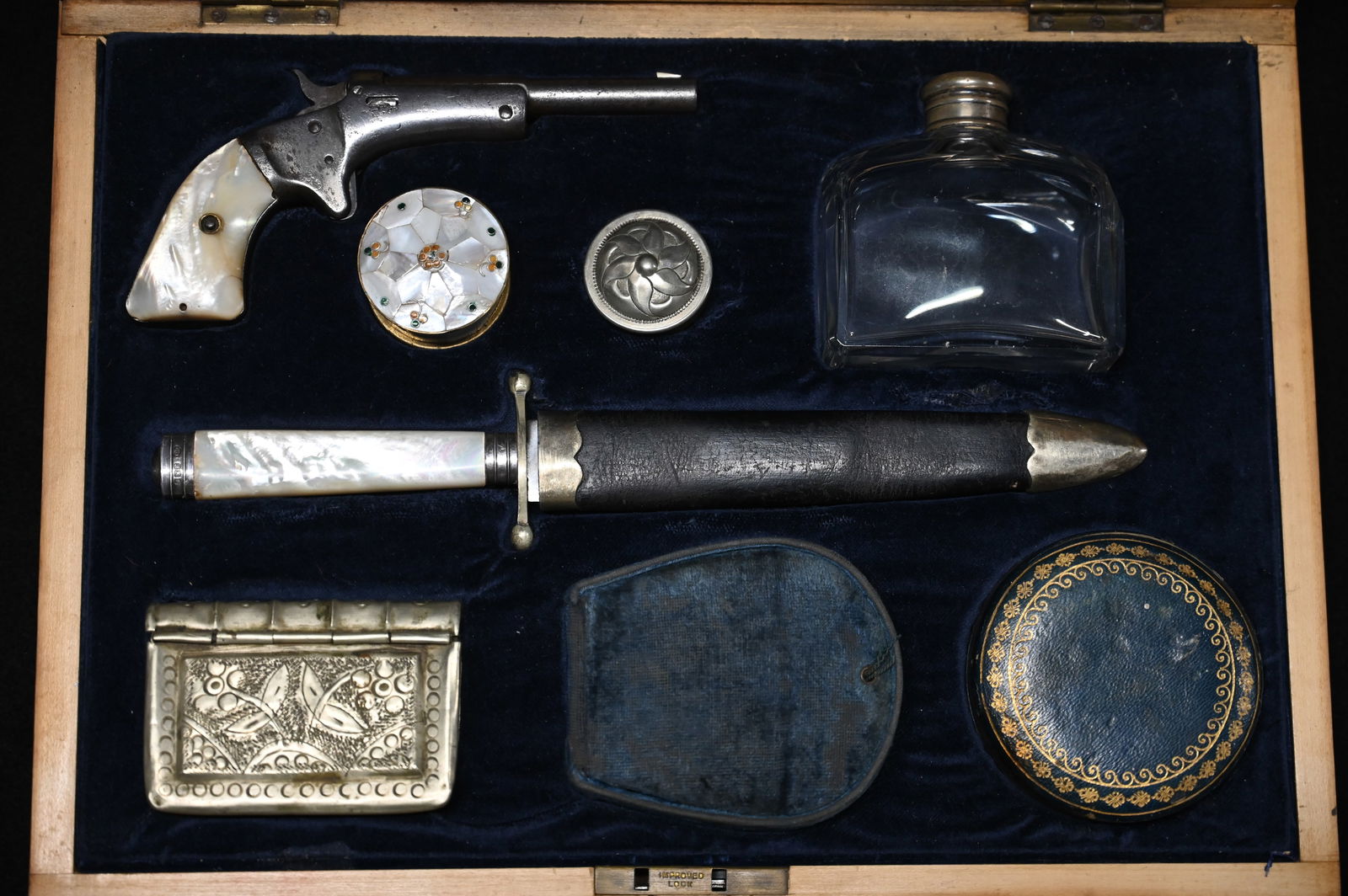 Victorian Era Pearl Handled Gun Traveling Kit: Pearl Handled Gun Kit W/Stevens Single Shot .22 Tip up Pistol. Pearl Grips, Nickel Finish, Barrel marked Stevens A&T CO. Chicopee Falls Massachusetts, SN95266 Ladies Gun. The pearl handled knife is ma