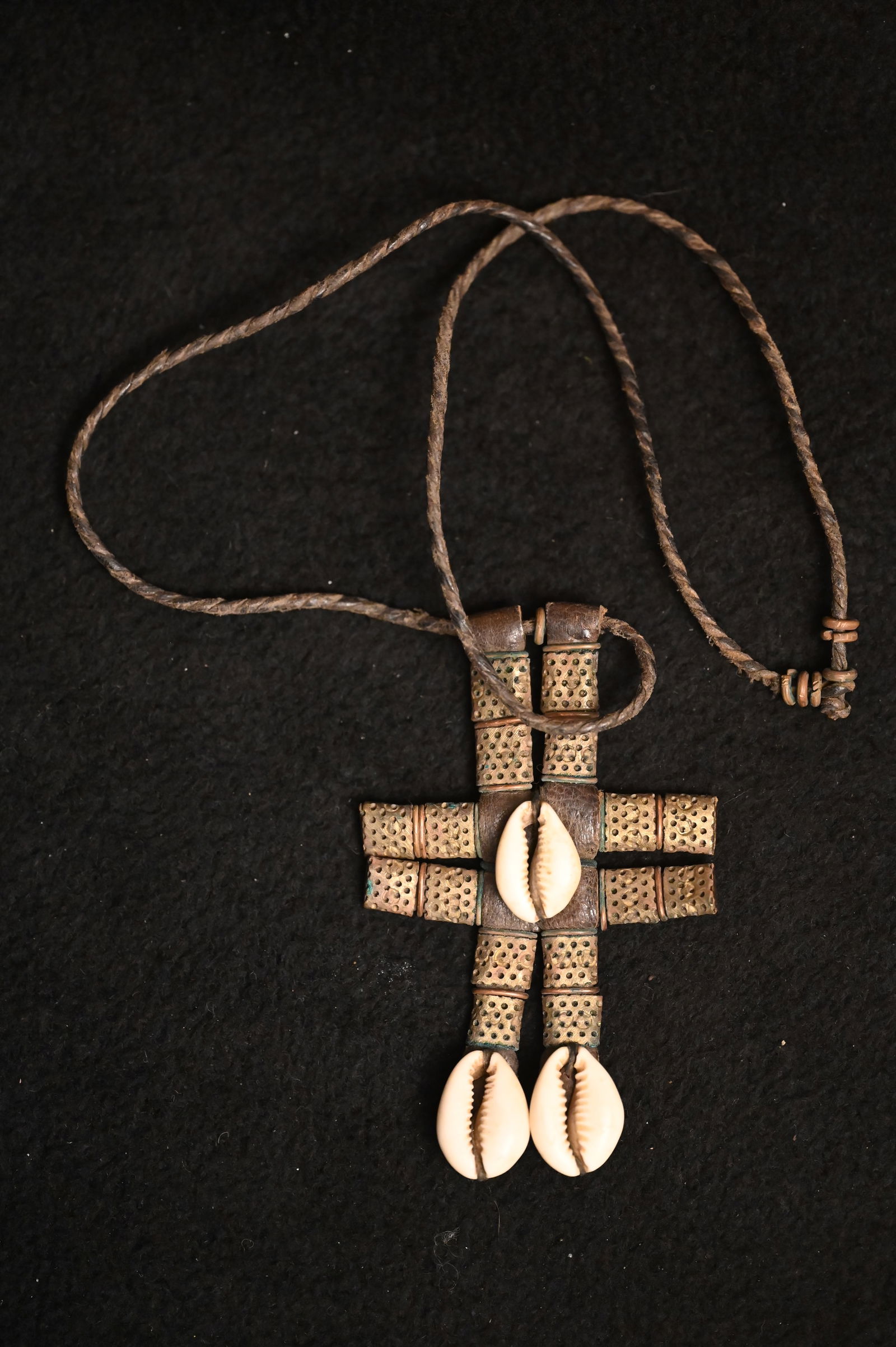 African Wodaabe Leather Cowrie Shell Talisman.: Traditional jewelry the Cowrie & Leather Shell necklaces made by the Wodaabe often feature intricate beadwork and cowrie shells, which hold cultural significance in many African communities. Cowrie sh