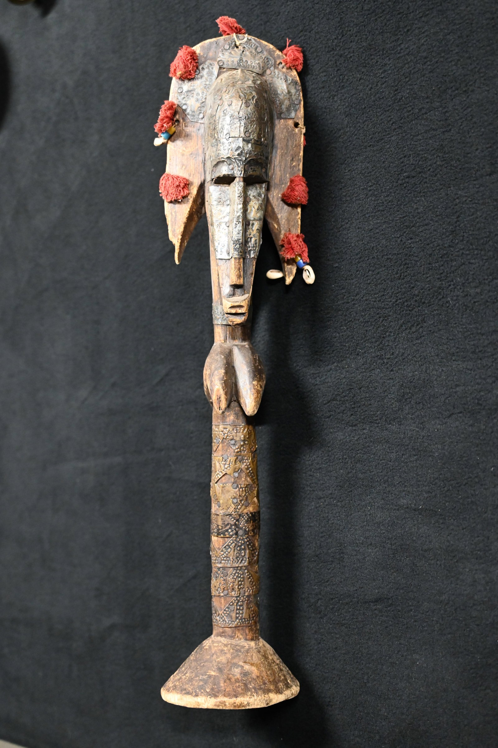 West African Bamana Puppet Janus Figure: Also known as Merekun, is a traditional puppet used in the Sogo Bo puppet theater of the Bamana people in Mali. Very intricately designed with stamped metal wrapped on the majority of the puppet. Used