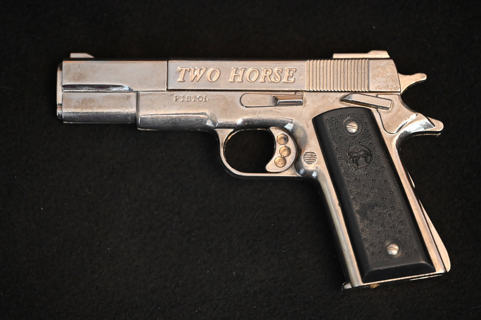 Two Horse Pistol Style Lighter 6 5/8". No fluid and not tested.: Two Horse Pistol Style Lighter 6 5/8". No fluid and not tested.