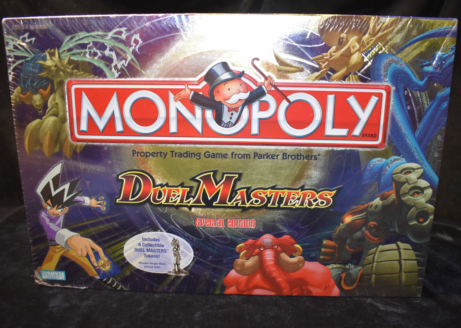 2004 Monopoly Duel Masters Special Edition Property Trading Game: Monopoly Duel Masters Special Edition Property Trading Game. 2004 New in the box. One corner of the box has wear. Otherwise still factory sealed.