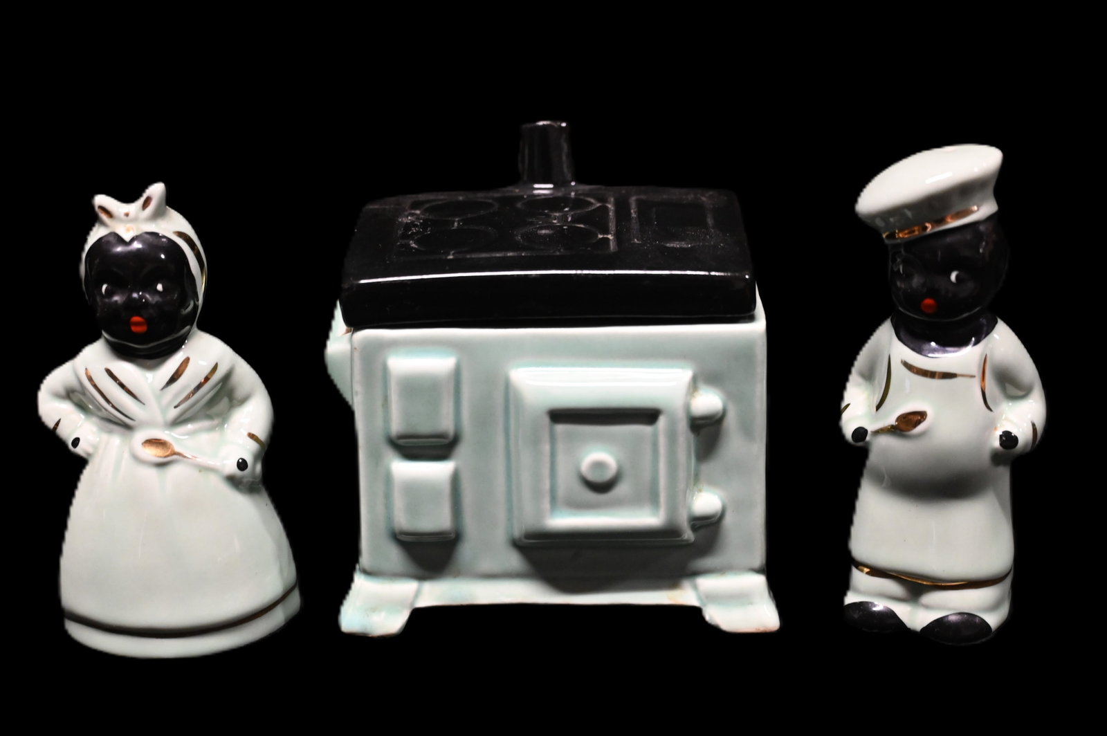 Mammy and Pappy 1940's Salt & Pepper Shakers with Grease Jar Stove. Black Americana Porcelain: Mammy and Pappy 1940's Salt & Pepper Shakers with Grease Jar Stove. Black Americana Porcelain figures standing 4 3/4" tall and in great condition.