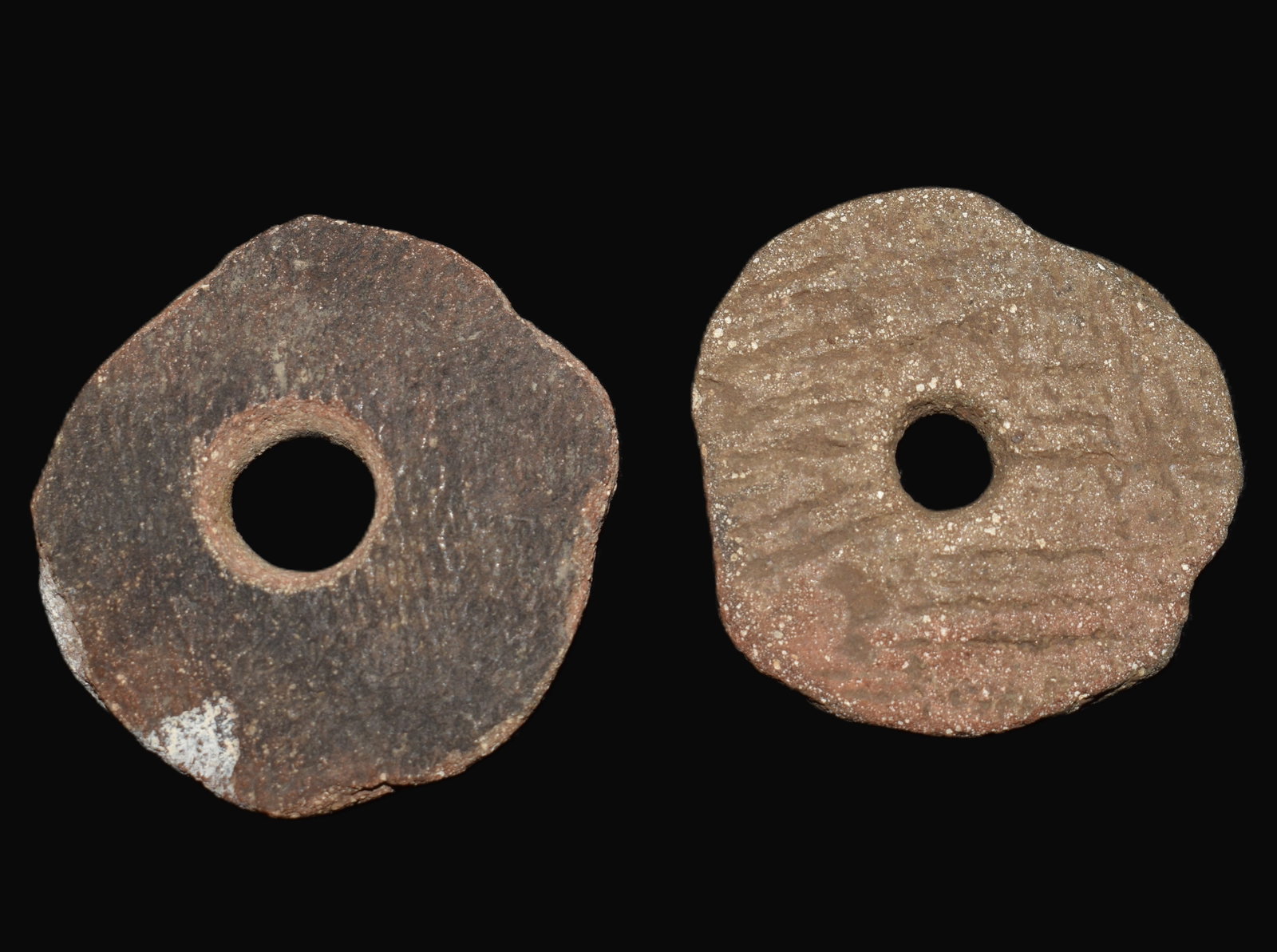 2 Large Drilled Pottery Beads found in Pulaski County, Missouri: 2 Large Drilled Pottery Beads found in Pulaski County, Missouri by Tony Rickerson. The Native Americans made these from pottery shards. Exhibits correct manufacture and excellent patination.