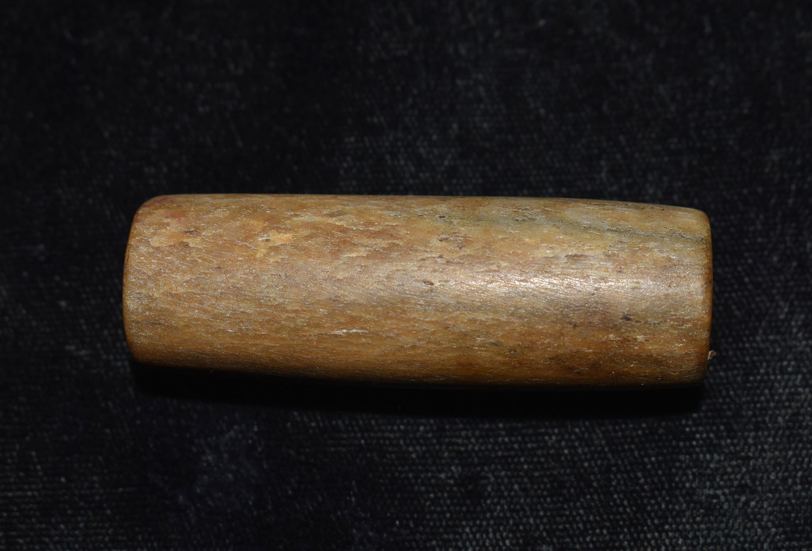 2 1/4" Bone or Antler Tube Pipe from the John Grody Collection: 2 1/4" Bone or Antler Tube Pipe from the John Grody Collection. Could be a large bead. Most likely modern made. The inside of the piece is drilled like we see on most of the modern banner stones made