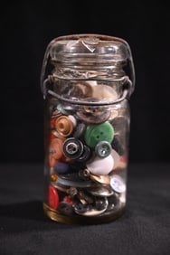 Vintage Glass Jar full of old Buttons.