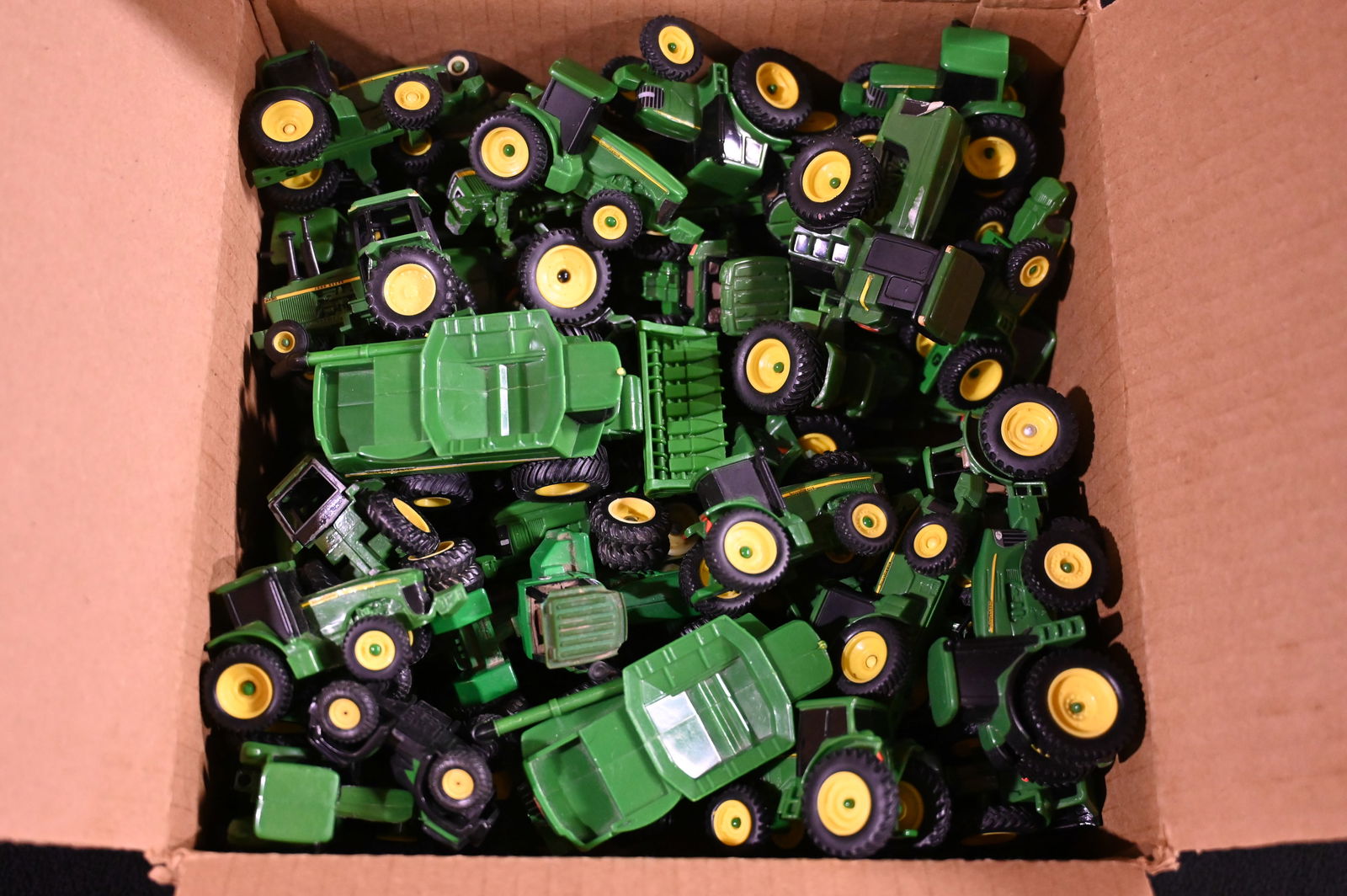 Approx. 40 John Deere Toy Tractors and Combines 1/64 Scale. (1 of 5)