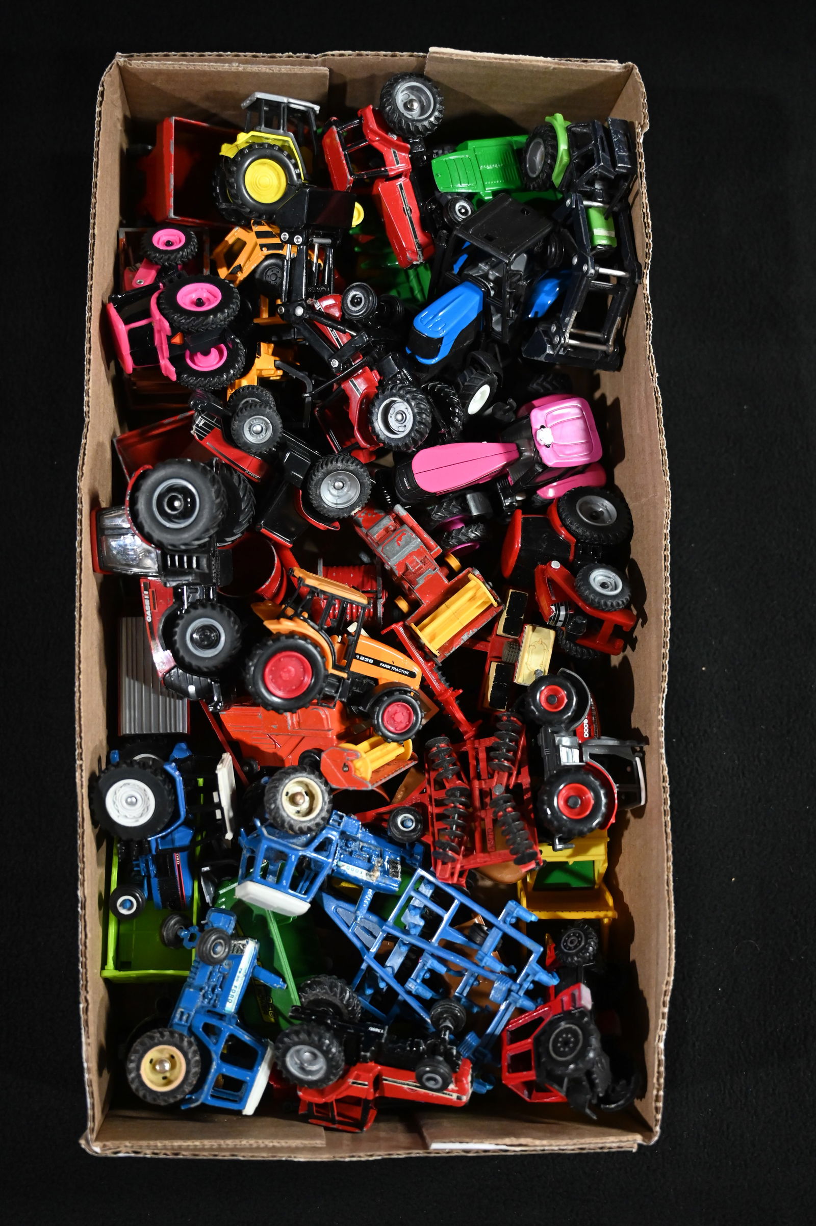 Approx. 40 Toy Tractors and Farm Implements includes International, Ford, Case, and more 1/64 Scale. (1 of 5)