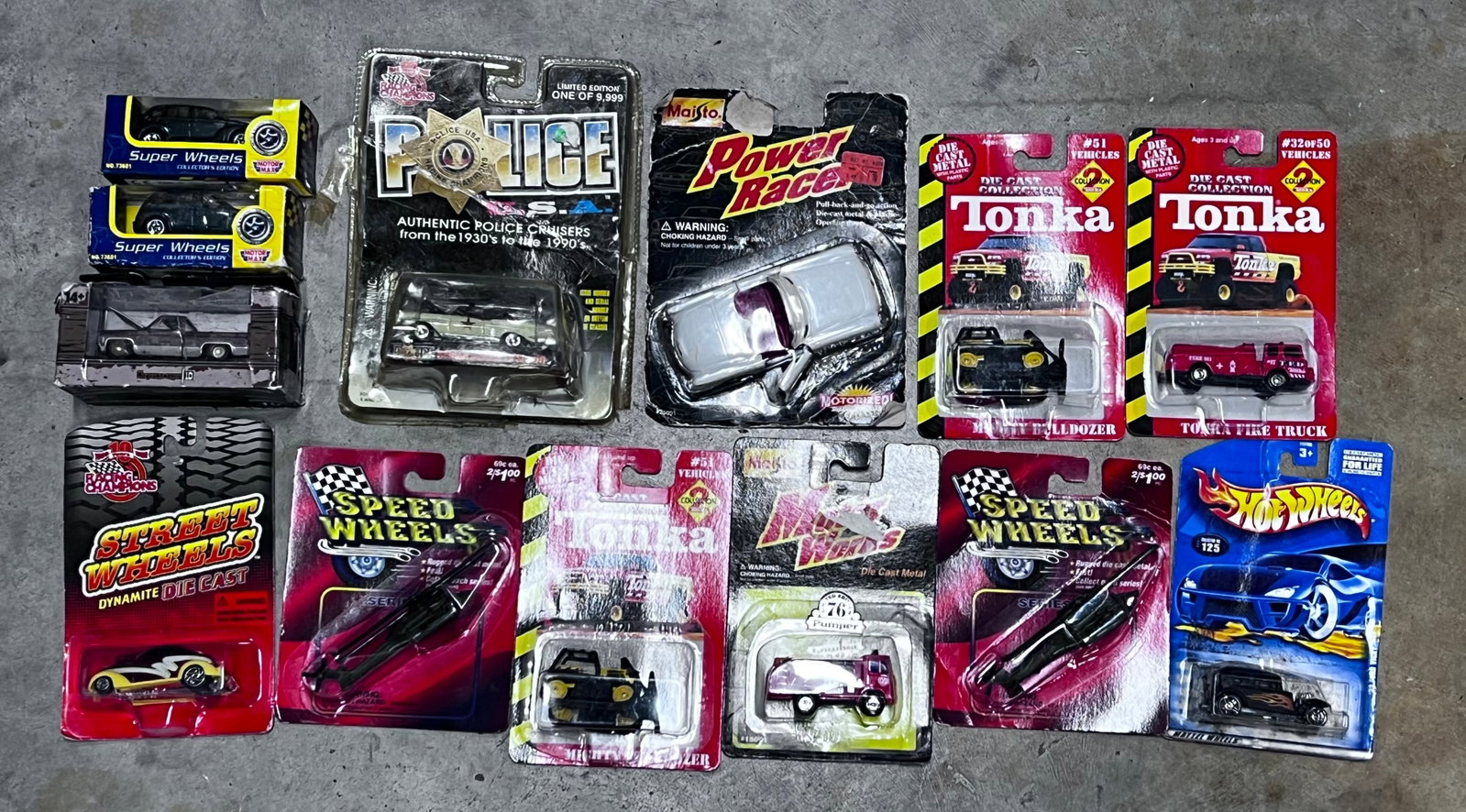 12 Die Cast Metal Toy Cars and Trucks in unopened condition. Packages are rough on some of them.: 12 Die Cast Metal Toy Cars and Trucks in unopened condition. Packages are rough on some of them.