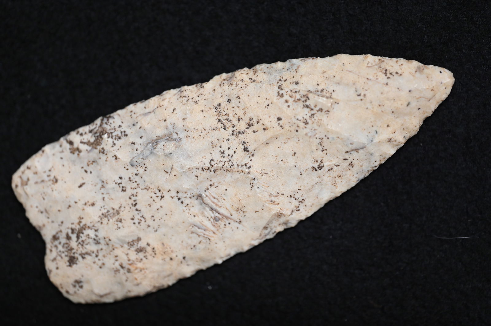 4 1/8" Rare Clovis Knife Found in Montgomery Co. ILL Keele COA Ex: Jim Davis, Ray Arnett: 4 1/8" Rare Clovis Knife Found in Montgomery Co. Illinois. Keele COA Ex: Jim Davis, Ray Arnett Collections. Covered in mineral deposits patination.