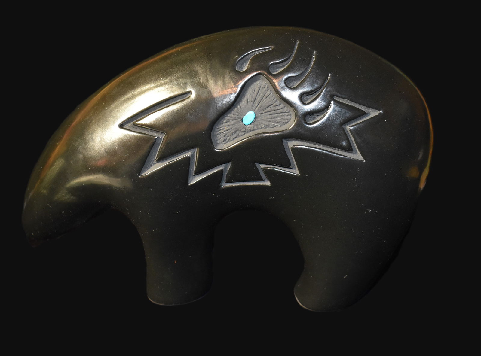 Navajo Black Glazed Pottery Bear (20th to 21st Century): Navajo Black Glazed Pottery Bear (20th to 21st Century). The pebble on the one side appears to be turquois. Hannah didn't sign this bear. AI determined it was made by Hannah Jay Kinlcheni a prominent