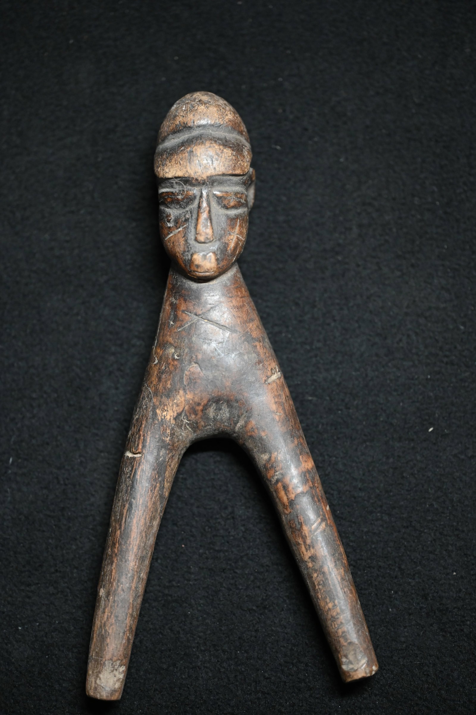 Lobi Figural 7 1/4" Slingshot from Burkina Faso, West Africa.: These slingshots are hand carved from wood and often feature human or animal figures. They were traditionally used for hunting and defense, but are also considered powerful talismans that bring luck a