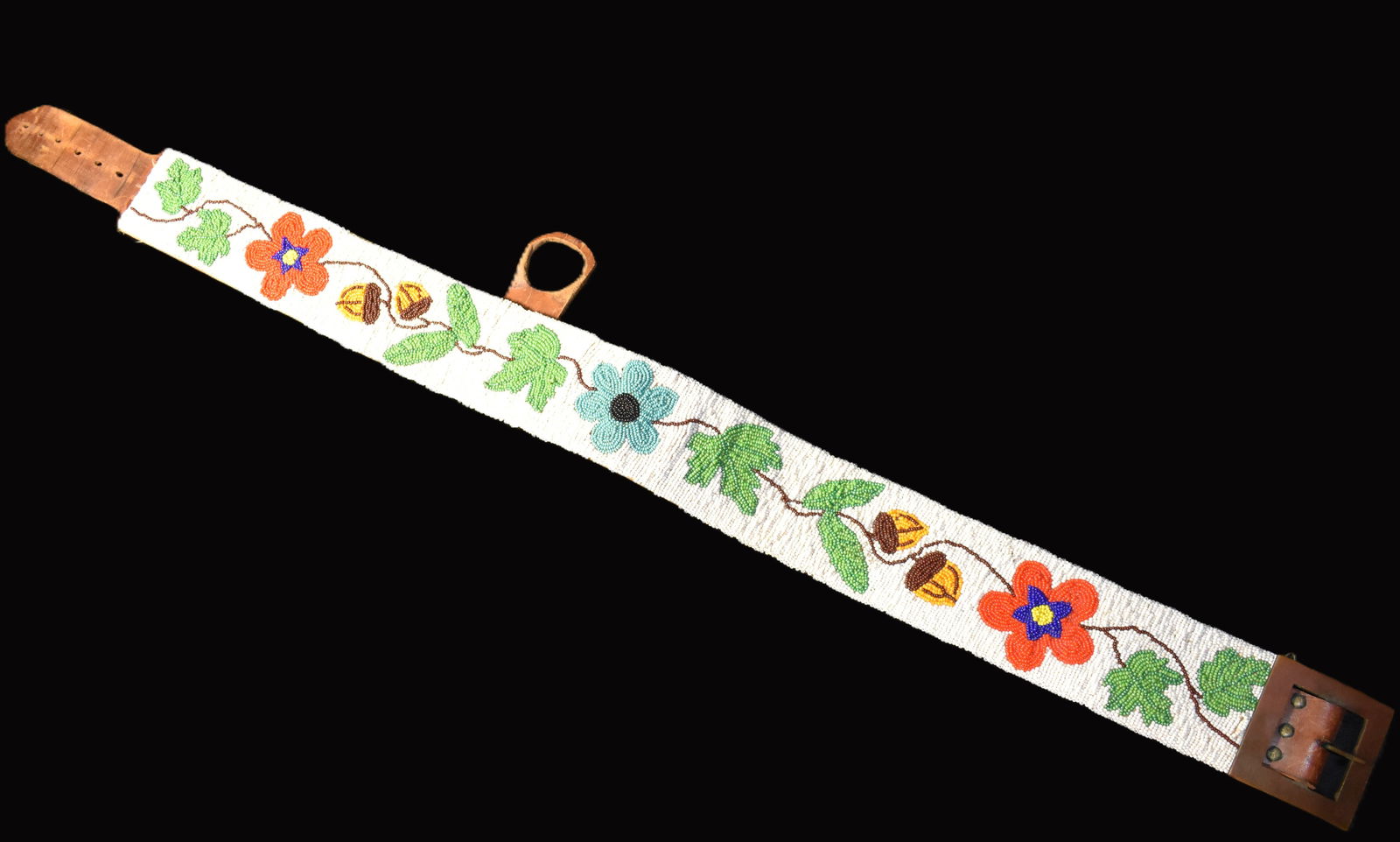 Large Decorative Leather Beadwork Belt - 44": Large Decorative Leather Beadwork Belt - 44". It's unclear if this was made by a Native American but it is all hand done with thousands and thousands of beads. Used as a Pow Wow/Rendezvous accessory b