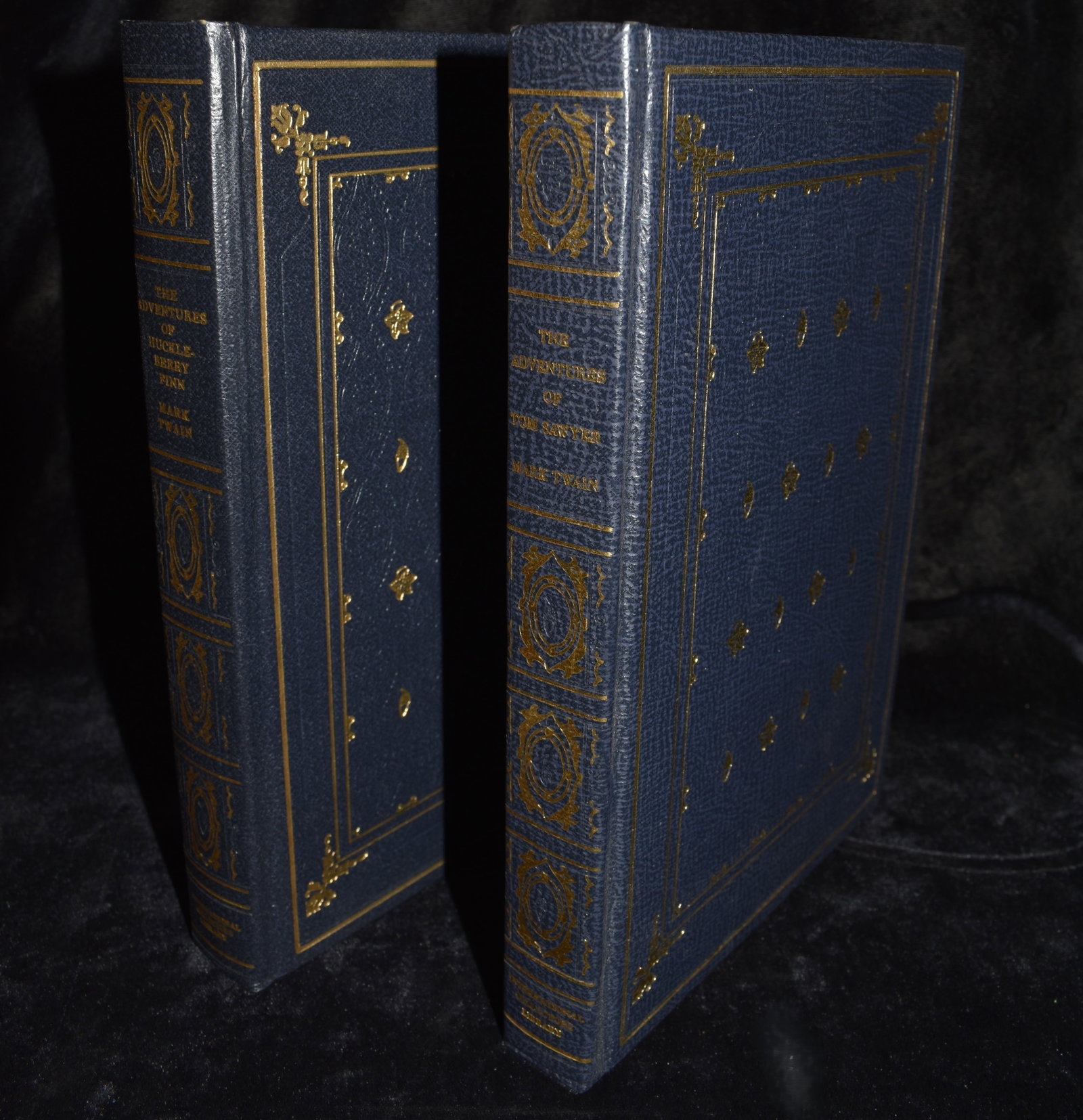 The Adventures of Huckleberry Finn & Tom Sawyer by Mark Twain - Two Decorative Hardbacks: The Adventures of Huckleberry Finn & The Adventures of Tom Sawyer by Mark Twain. Published by International Collectors Library circa 1971. Fine or near fine condition faux leather hardbacks with gold 