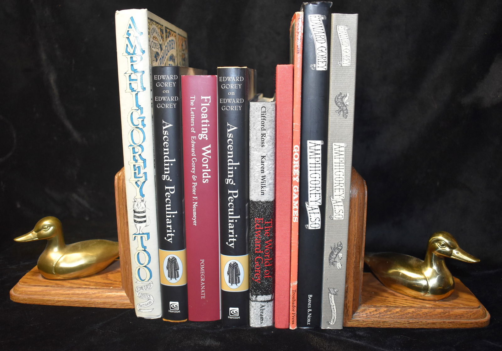 Edward Gorey (9 Books) Amphigory Also x2, Ascending Peculiarity x2 1st Editions, Gorey Games, The: Edward Gorey (9 Books) Amphigory Also x2 - One hard back in excellent condition w/ dust cover 2002 and Softback in good condition (minor shelf wear); Gorey Games 1979 softback in fairly good condition