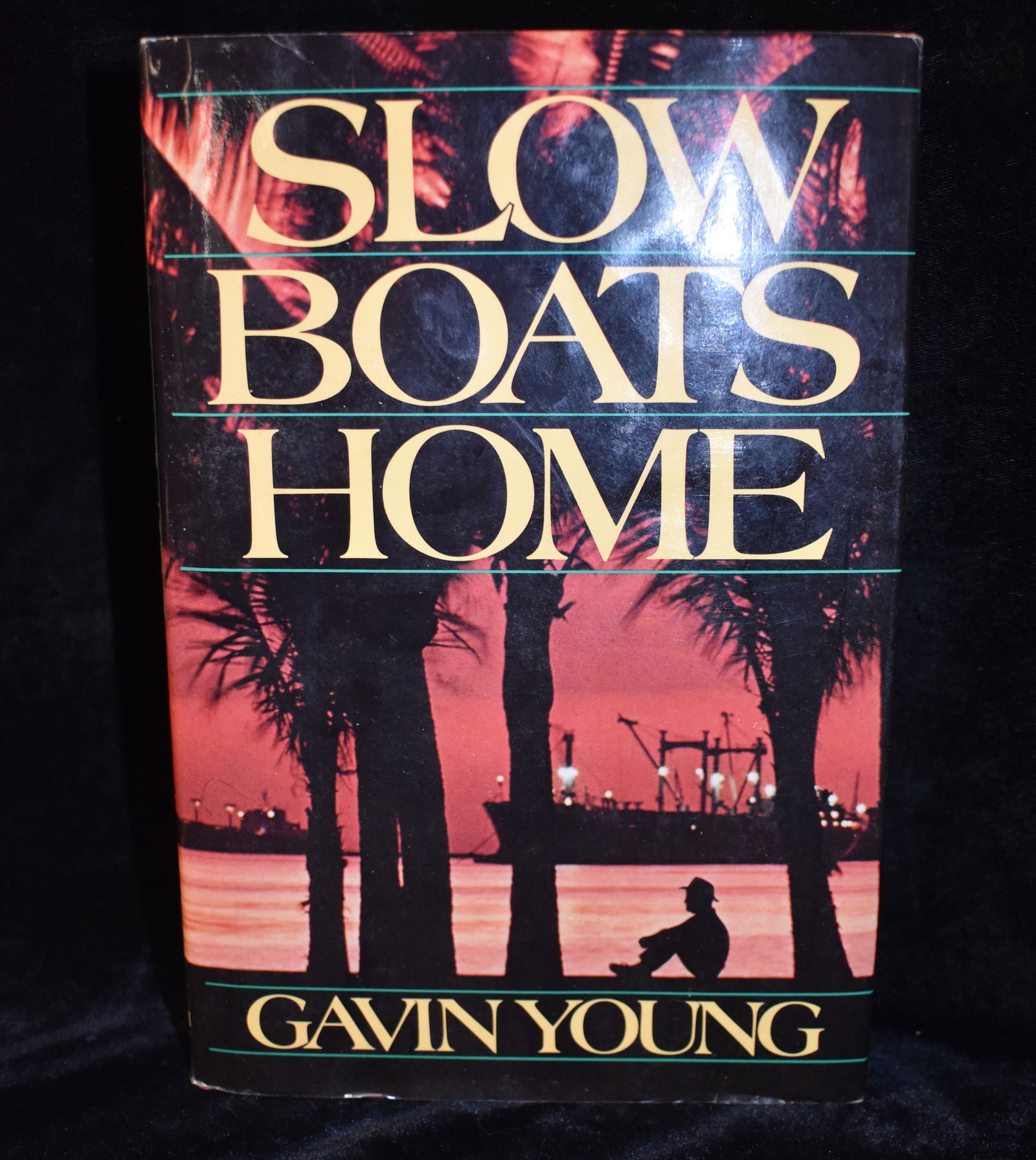 1st Edition SLOW BOATS HOME by Gavin Young, - 1985 Hardback: SLOW BOATS HOME by Young, Gavin. Published by Random House, New York, 1985. 1st American Edition. Excellent condition hardback with dust cover.