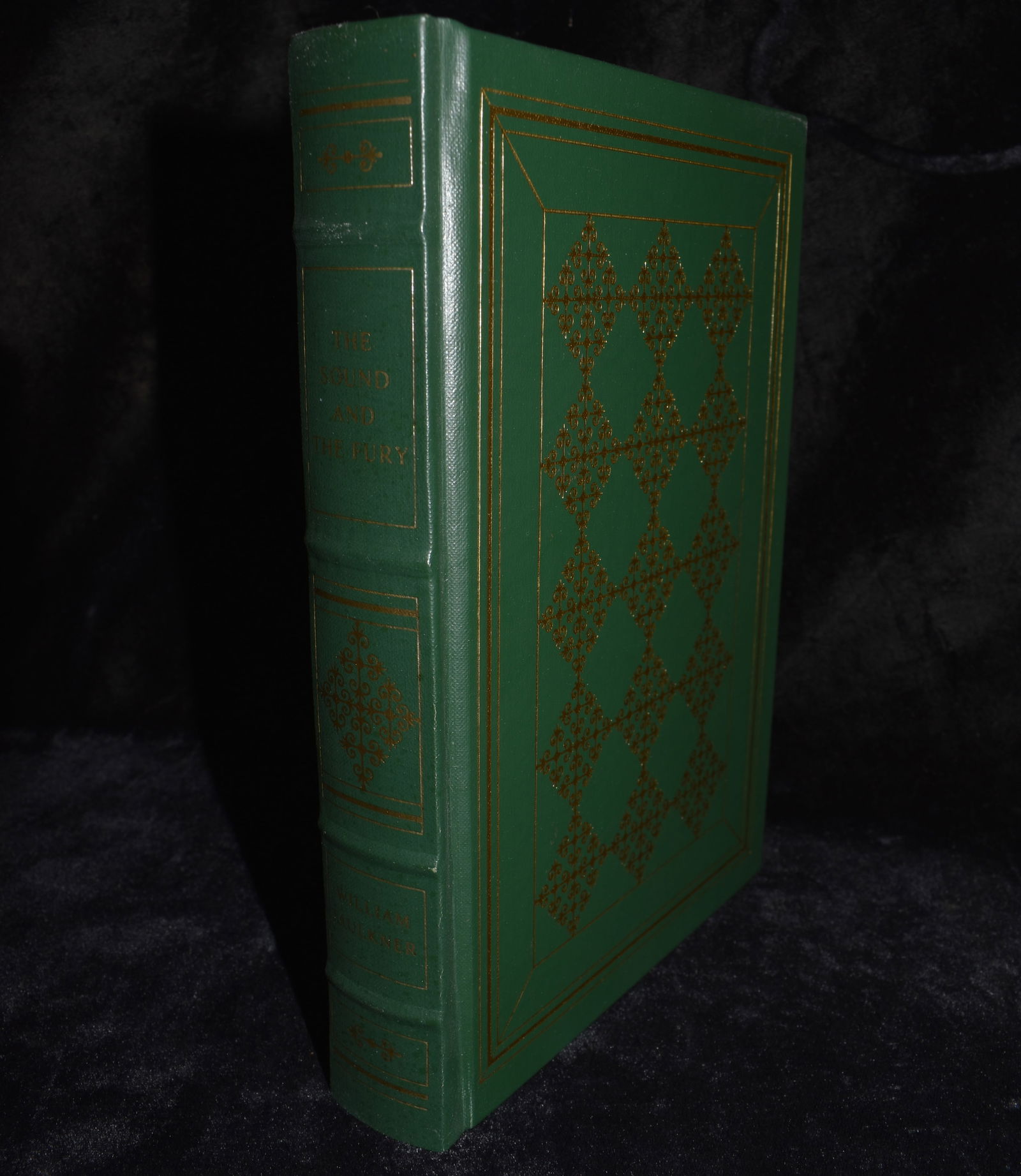 1977 The Sound and the Fury by William Faulkner - Faux Leather Fine Hardback: The Sound and the Fury by Faulkner, William. Published by Franklin Library, Franklin Center, Pa, 1979. Fine or near fine condition hardback. Faux leather cover w/ gold gilt to cover and all page ends.