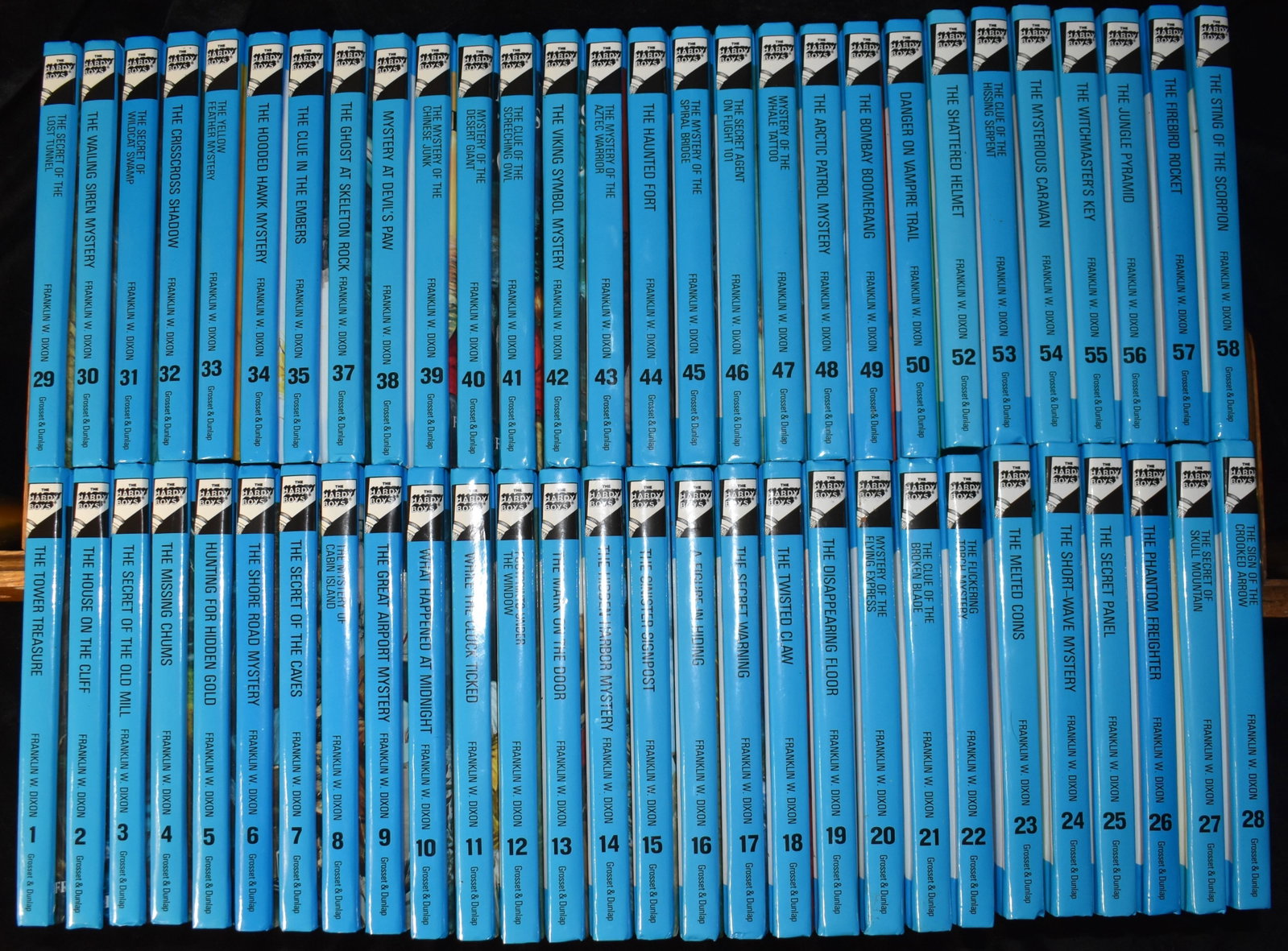 The Hardy Boys by Franklin W. Dixon - 56 Volumes Hardbacks 2002: The Hardy Boys by Dixon, Franklin W. - 56 Volumes Published by Grosset & Dunlap 2002. Fine or near fine condition hardback set of books (look like new, unread and unmarked). 36 & 51 are not present wi