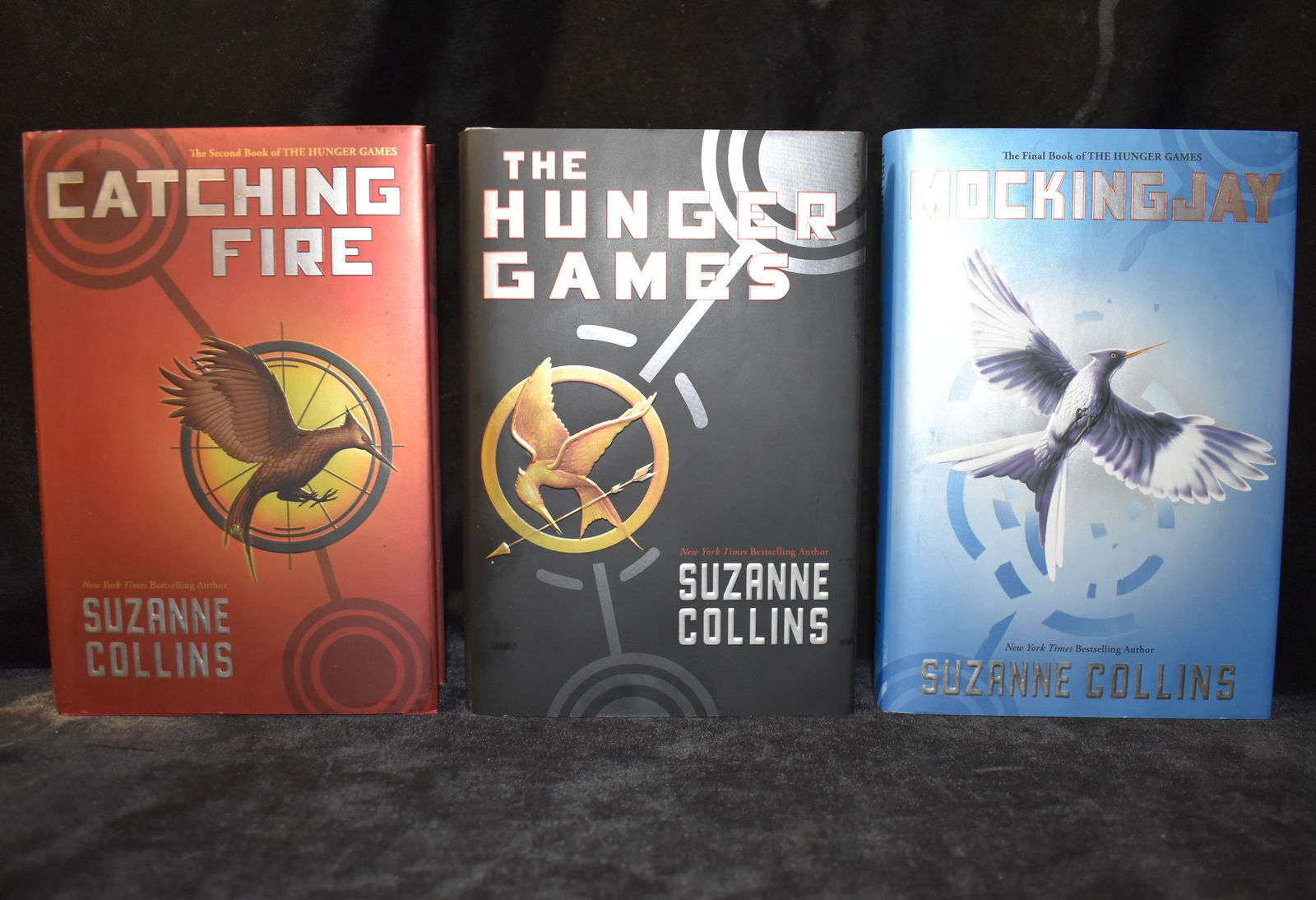 3 1st Editions - The Hunger Games, Catching Fire & Mockingjay by Suzanne Collins: The Hunger Games Trilogy by Collins, Suzanne. Published by Scholastic Press, 2008. All 3 are 1st Edition's. Fine to near fine condition hardbacks with dust covers still in excellent condition. The Hun