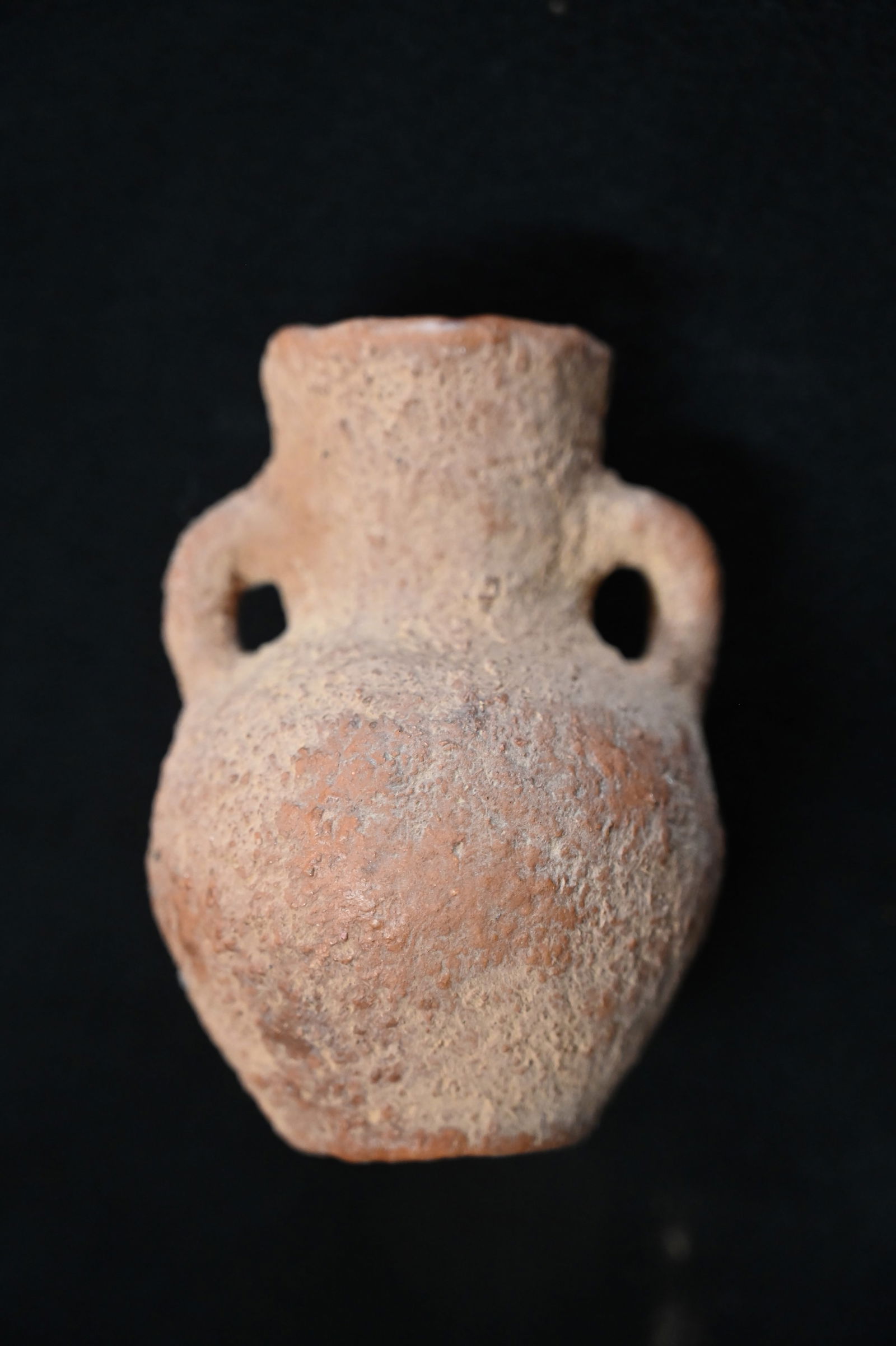 4 1/4" Ancient Roman Oil Jar "Amphora".: These terracotta vessels were used for storing and transporting goods like olive oil, wine, and grains.