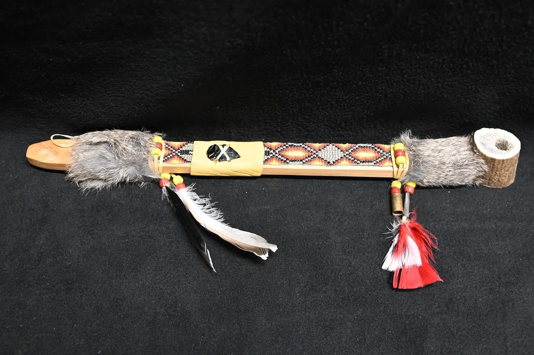 17 3/4" Personal Pipe with Antler Bowl and with a beaded leather and Rabbit Fur wrapped wood Stem: 17 3/4" Personal Pipe with Antler Bowl and with a beaded leather and Rabbit Fur wrapped wood Stem with a beaded feather drops and an Arrowhead for decoration. This is a fully functional well made pipe