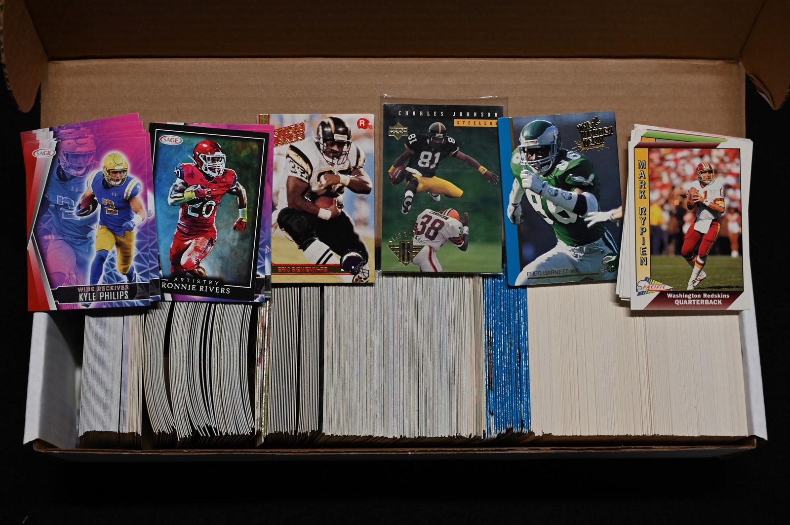 Mixed Group of Approx. 800 Football Cards 80's, 90's, 2000's.: Mixed Group of Approx. 800 Football Cards 80's, 90's, 2000's. All Cards are in good to great condition. We made sure the boxes were full and did not search through them. Should find some good cards in