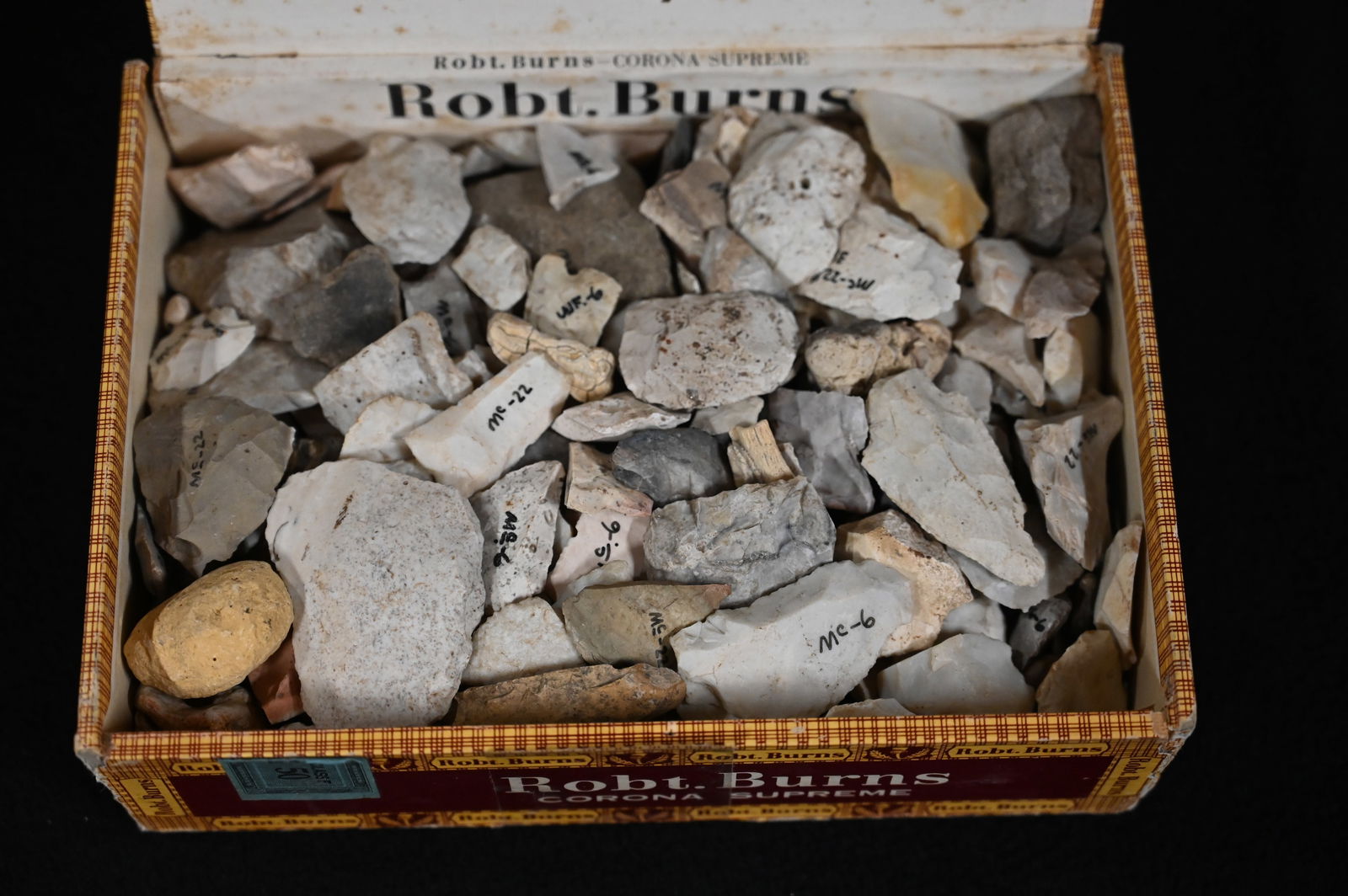 Cigar Box Full of Damaged Arrowheads Found in Fulton Co. Illinois and surrounding Counties. Cigar: Cigar Box Full of Damaged Arrowheads Found in Fulton Co. Illinois and surrounding Counties. Cigar Box measures approx. 8 1/2" x 5 1/2" x 3". Weighs approx. 5 pounds.