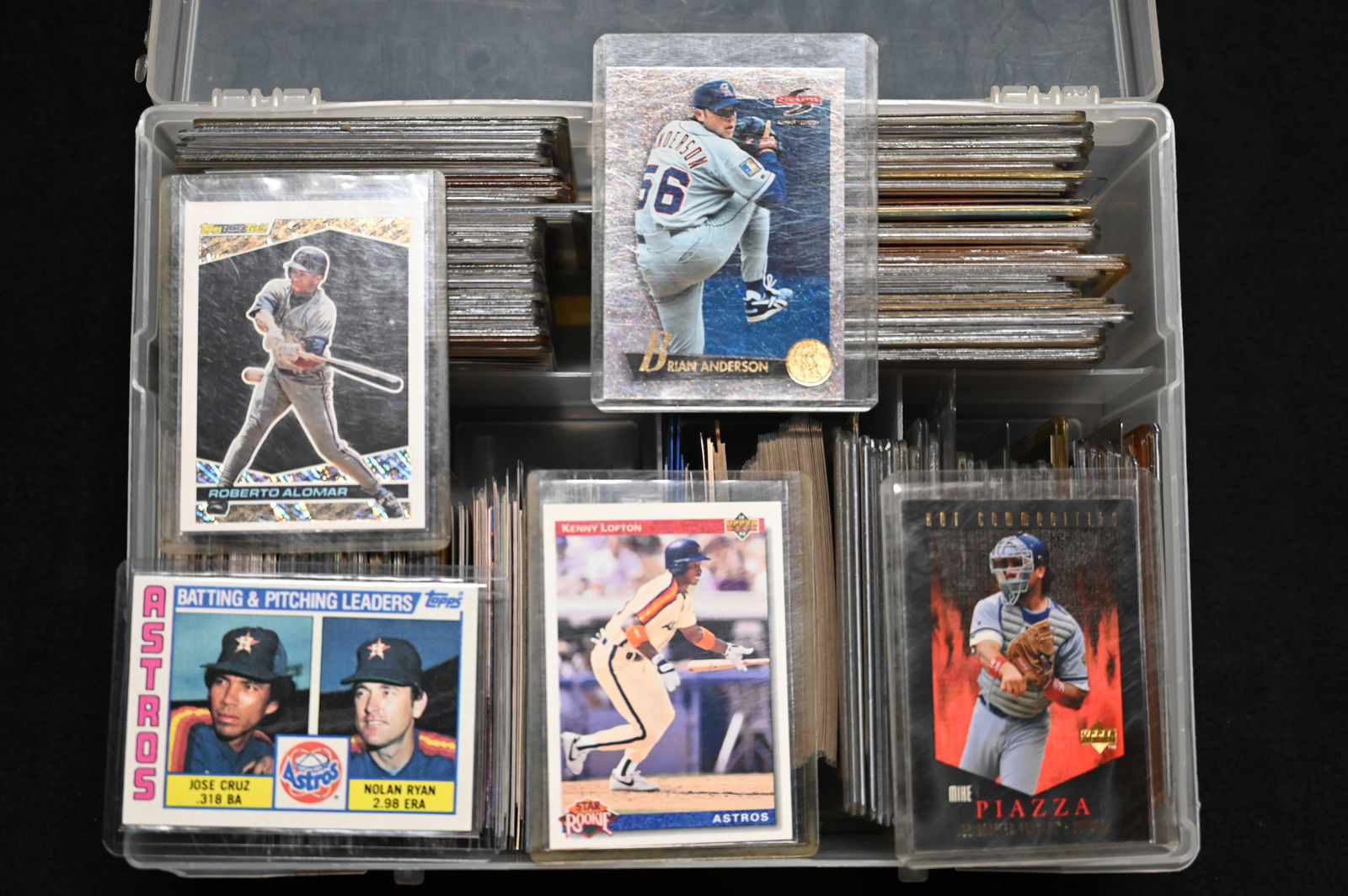 Plastic Container Full of Good Cards most in hard plastic sleeves. Includes a lot of Nolan Ryan: Plastic Container Full of Good Cards most in hard plastic sleeves. Includes a lot of Nolan Ryan baseball cards.