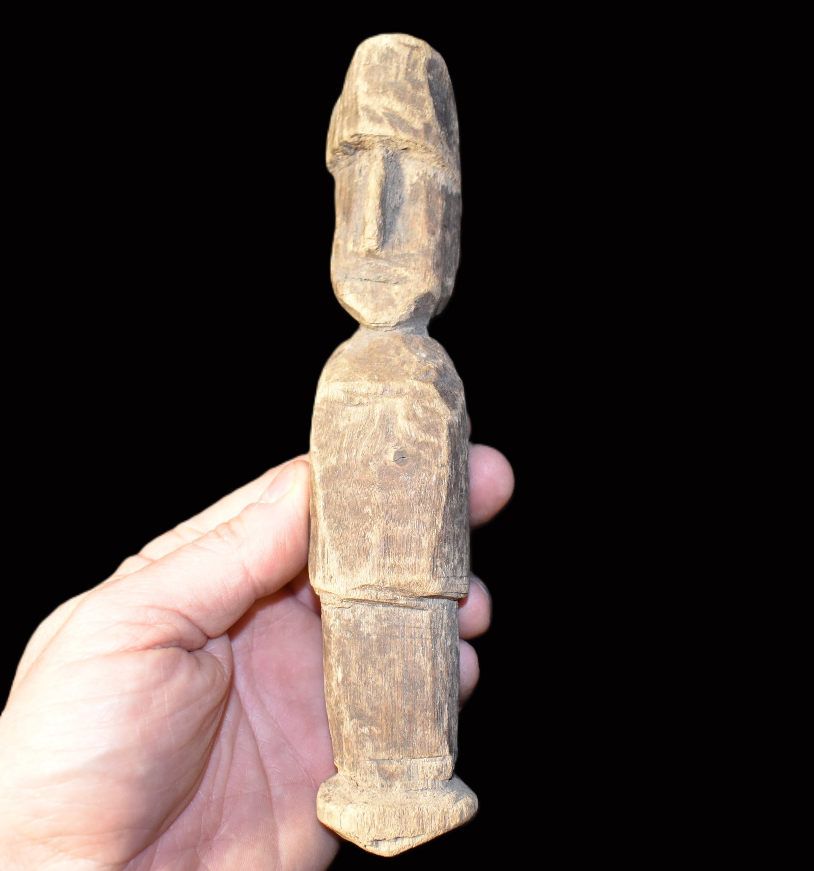 Late 19th Century Dayak (Borneo) Carved Wooden Figure - 7": A hand carved wooden figure attributed to the Dayak peoples of Borneo dating to the late 19th century. The carving is executed in a traditional village style with a cylindrical body minimal facial fea