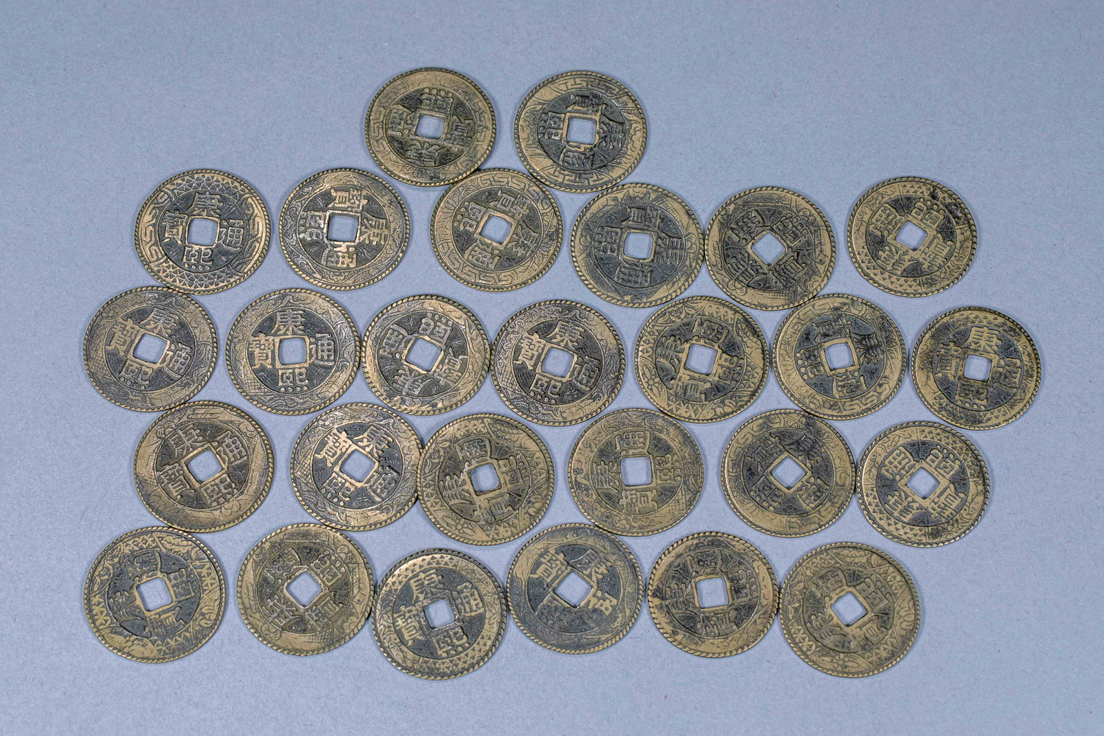 Twenty-seven copper coins of Kangxi Tongbao in ancient China (1 of 4)
