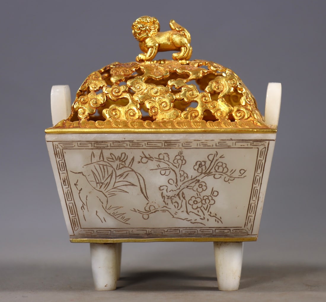 Gold Gilt Hetian Jade Incense Burner with Engraved Characters: This is a quadrangle incense burner covered with gold in Hetian jade, which is an old Tibetan antique. With Hetian jade as the main material, the body of the incense burner is carved with floral patte