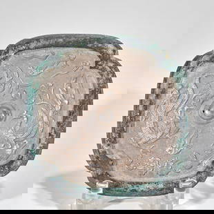 Before Ming Dynasty, silver-inlaid dragon and phoenix auspicious copper mirror: Bronze (with green patina and mirror-like surface, inlaid with silver, the silver is fine and white).Relief carving and inlaid silver (the relief carvings of dragons and phoenixes, flowers and birds a