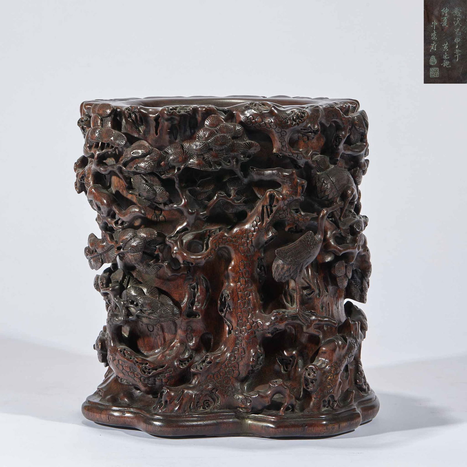 Incense wood "Longevity of the Pine and Crane" pen holder: The agarwood (with a deep brown color, a distant and elegant aroma, and a dense texture, it is a rare material for writing desks in ancient times).High-relief and hollowing-out (the high-relief carvin