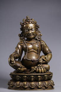 Qing Dynasty copper inlaid silver yellow money god sitting statue: Bronze with silver inlay (the design of the necklace and clothing patterns are outlined with silver wires on a copper base). Made by the lost-wax casting method, the silver inlay technique is exquisit
