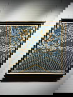 Mid to late Qing Dynasty brocade silk dragon pattern: The brocade (silk with "continuous warp and discontinuous weft" in blue ground and gold patterns) featuring dragon patterns and sea and mountain waves is a material for official robes (a symbol of ran