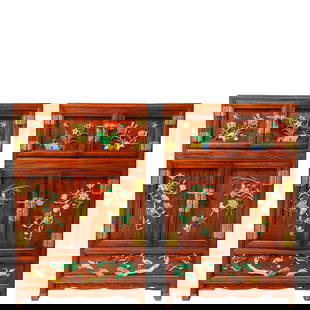 A pair of multi-compartment cabinets with inlaid yellow flowers and birds, depicting "Longevity of: A Pair of Huanghuali Multi-Treasure Cabinets with Inlaid Flower-Bird and Pine-Crane Motifs for Longevity:Crafted from rare Huanghuali wood, these cabinets employ hundred-treasure inlay craftsmanship.