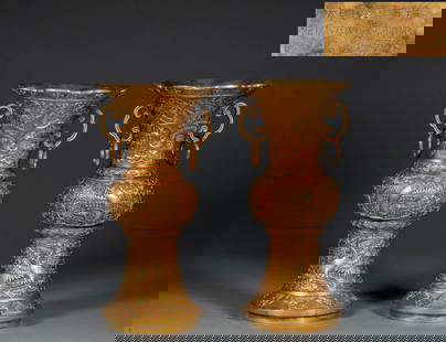 A pair of Qianlong period gilded copper flower vases with a design of cranes in the clouds: Pair of Ming Yongle Period Gilded Bronze Flower Gu Vases with Cranes in Clouds: The bronze body was cast and chased to depict cranes piercing clouds and interlocking flower patterns, gilded, with the
