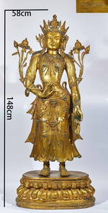 A gilt-bronze statue of the Bodhisattva Avalokitesvara holding a lotus from the Yongle period of the: A gilt-bronze Guanyin statue holding a lotus from the Yongle period of the Ming Dynasty: Made of bronze and gilded, it dates back to the Yongle era of the Ming Dynasty. The gilded Buddha statues of th