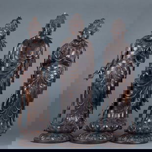 Incense Wood Three Buddha Images: The Three Buddha Statues of Agarwood: Made of agarwood and carved in the round, these standing statues of the Three Buddhas (Past, Present and Future Buddhas) feature fine details in their clothing an