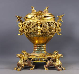 Bronze gilded hollowed-out beast jar with inscriptions from the Warring States and Han Dynasties,: This gilded bronze animal-shaped vessel with inscriptions from the Warring States to Han period is made of copper and features a gilded surface. Some parts have naturally formed patina and copper rust