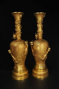 A pair of gilt-bronze engraved dragon vases: A pair of gilded copper and engraved coiled dragon vases, made of copper and crafted through gilding and engraving techniques, feature intricate engravings on the vase bodies, with three-dimensional c