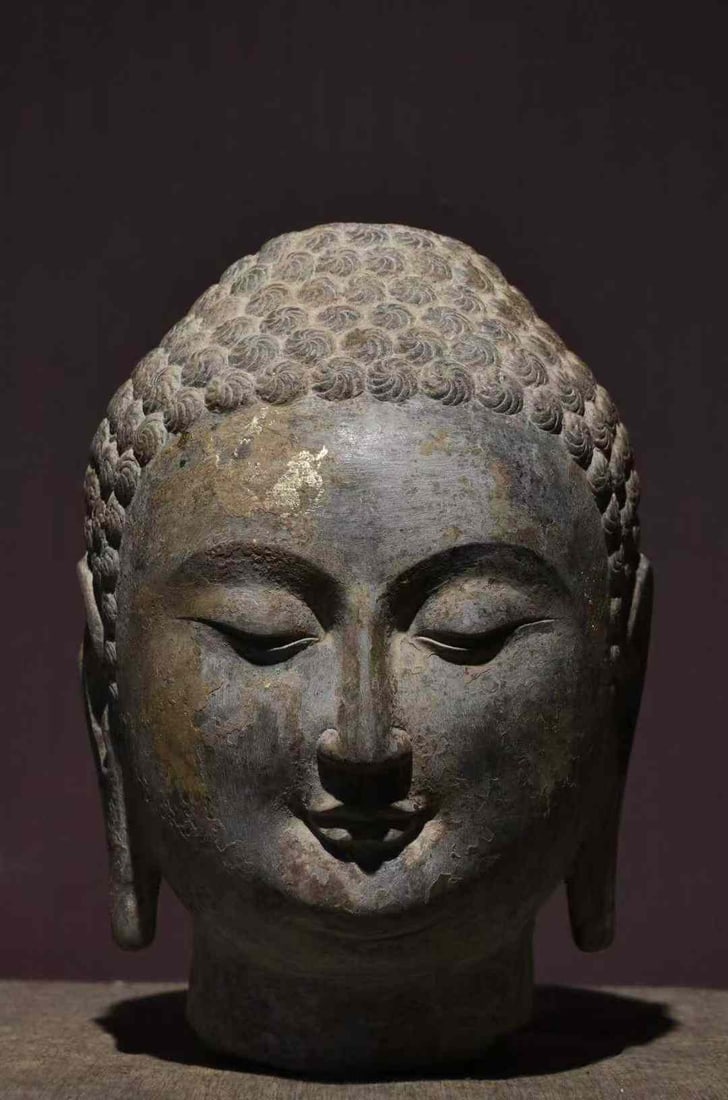 Buddha Head of the Northern Qi Dynasty, Qingzhou: Buddha Head from the Northern Qi Dynasty, Qingzhou Height 29cm Limestone Carved using the round carving technique, the surface was originally gilded and painted, with only residual traces remaining to