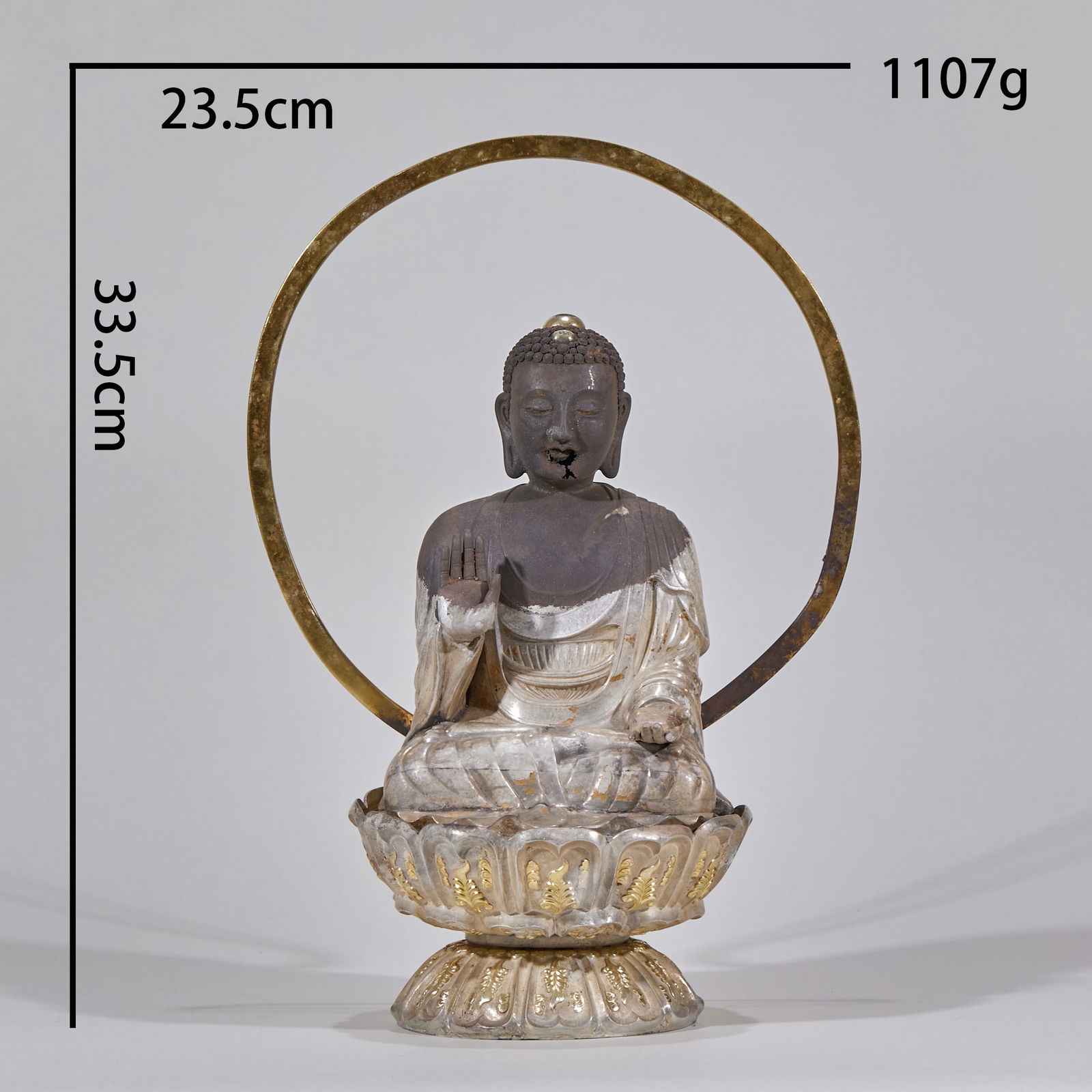 Silver Seated Buddha Statue on Lotus Base: Pure Silver Seated Buddha Statue on Lotus Base Height 33.5cm, Length 23.5cm, Width 14.5cm, Weight 1107g Pure silver with partial gold plating Crafted using repoussé and chasing techniques, the Buddha