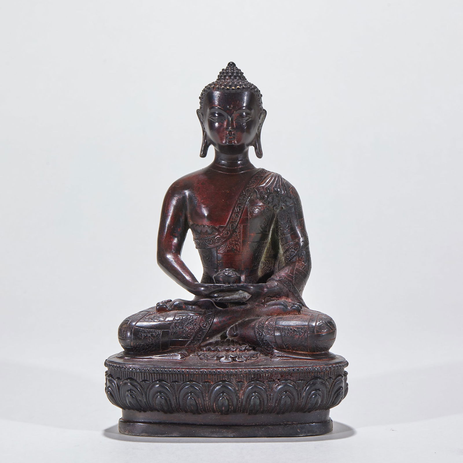 Bronze Statue of Bhaisajyaguru (Medicine Buddha): Bronze Medicine Buddha Statue, height 20cm, length 14cm, width 9cm, weight 993g, bronze with partial gilding and polychrome painting. The Buddha is seated in lotus position, holding a medicine pot in