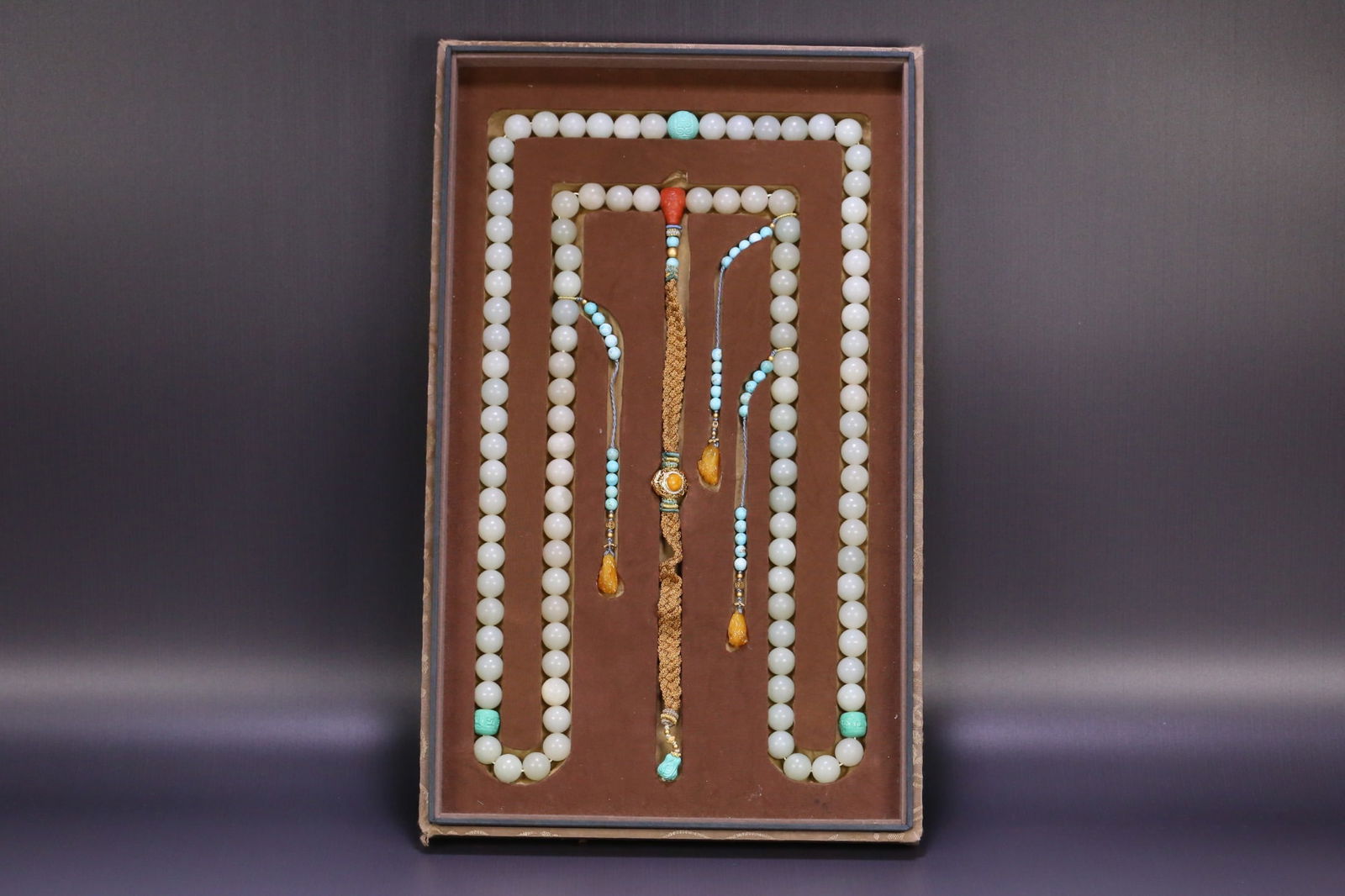 String of Hetian Jade Court Prayer Beads: String of Hetian Jade Court Beads, single bead diameter 1.4cm, total weight 511.5g, Hetian white jade with turquoise and coral spacer beads, agarwood Buddha head beads, and amber pendant. The court be