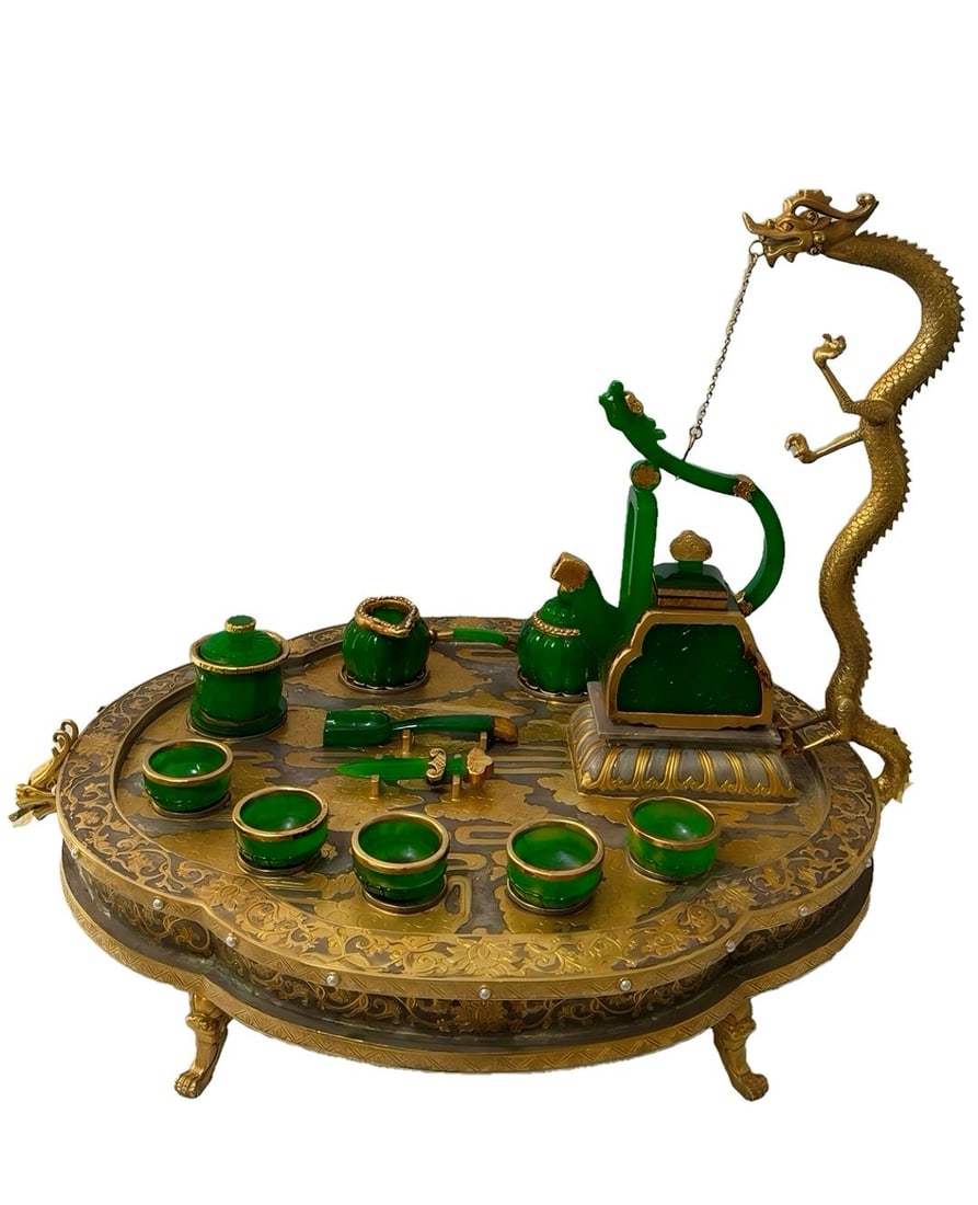 Gilt Inlaid Jadeite Dragon-Head Beam Tea Set, Qianlong Reign Mark, A Set: Qianlong Marked Gilt Gem-Inlaid Jadeite Dragon Head Beam Tea Set , one set, height 46cm, length 60cm, width 45cm, gilt silver base with high ice imperial green jadeite tea set. The tea tray is carved